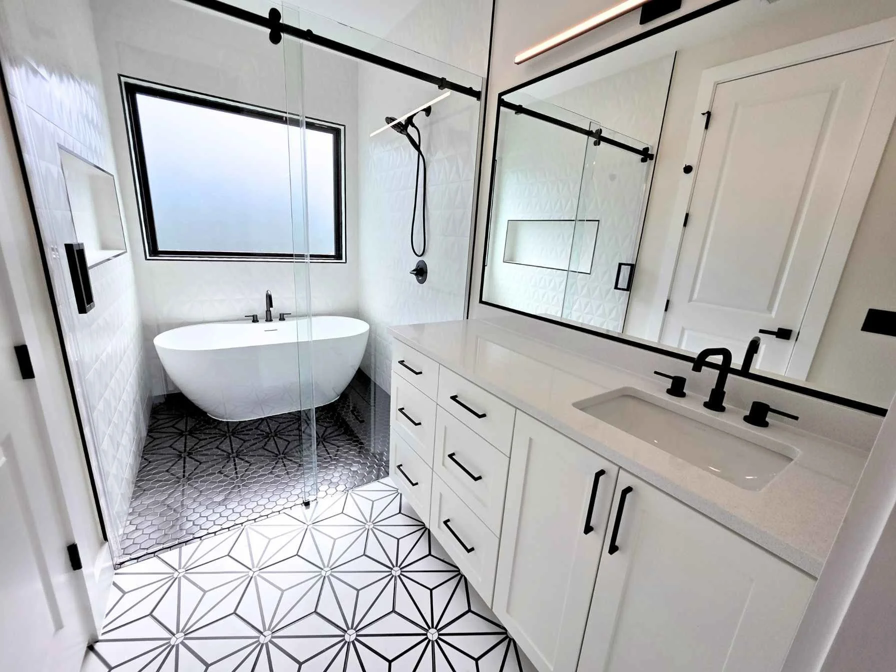 Custom bathroom in a downtown Austin ADU by Atria Design and Build.