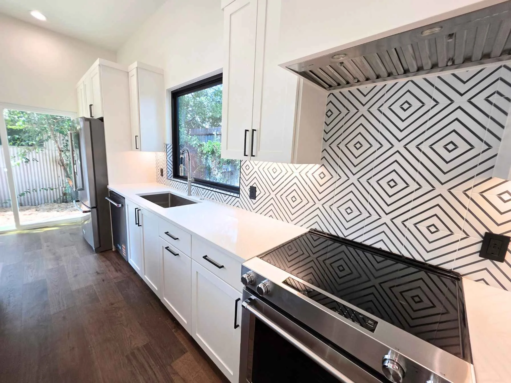 Open kitchen in a two-bedroom downtown Austin ADU by Atria Design and Build.