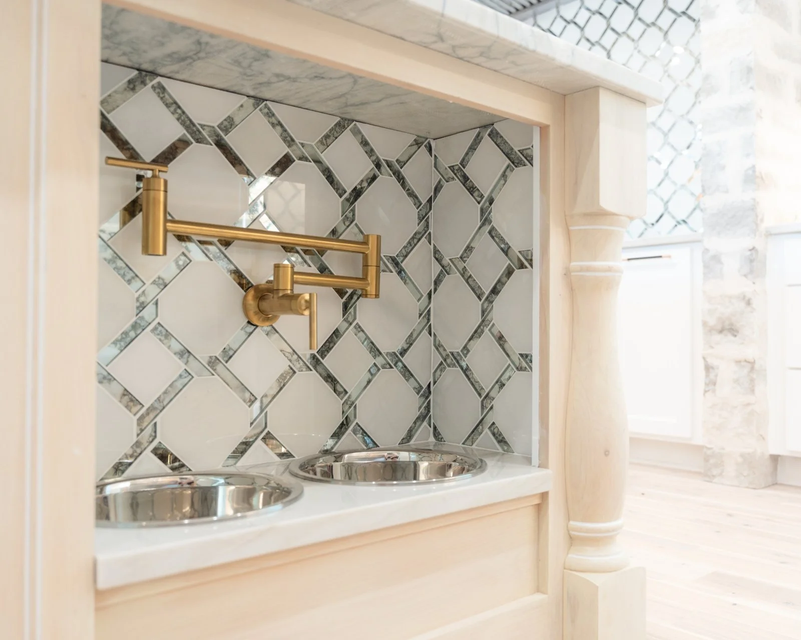 Open concept kitchen and living room remodel with natural quartzite countertops by Atria Design + Build.