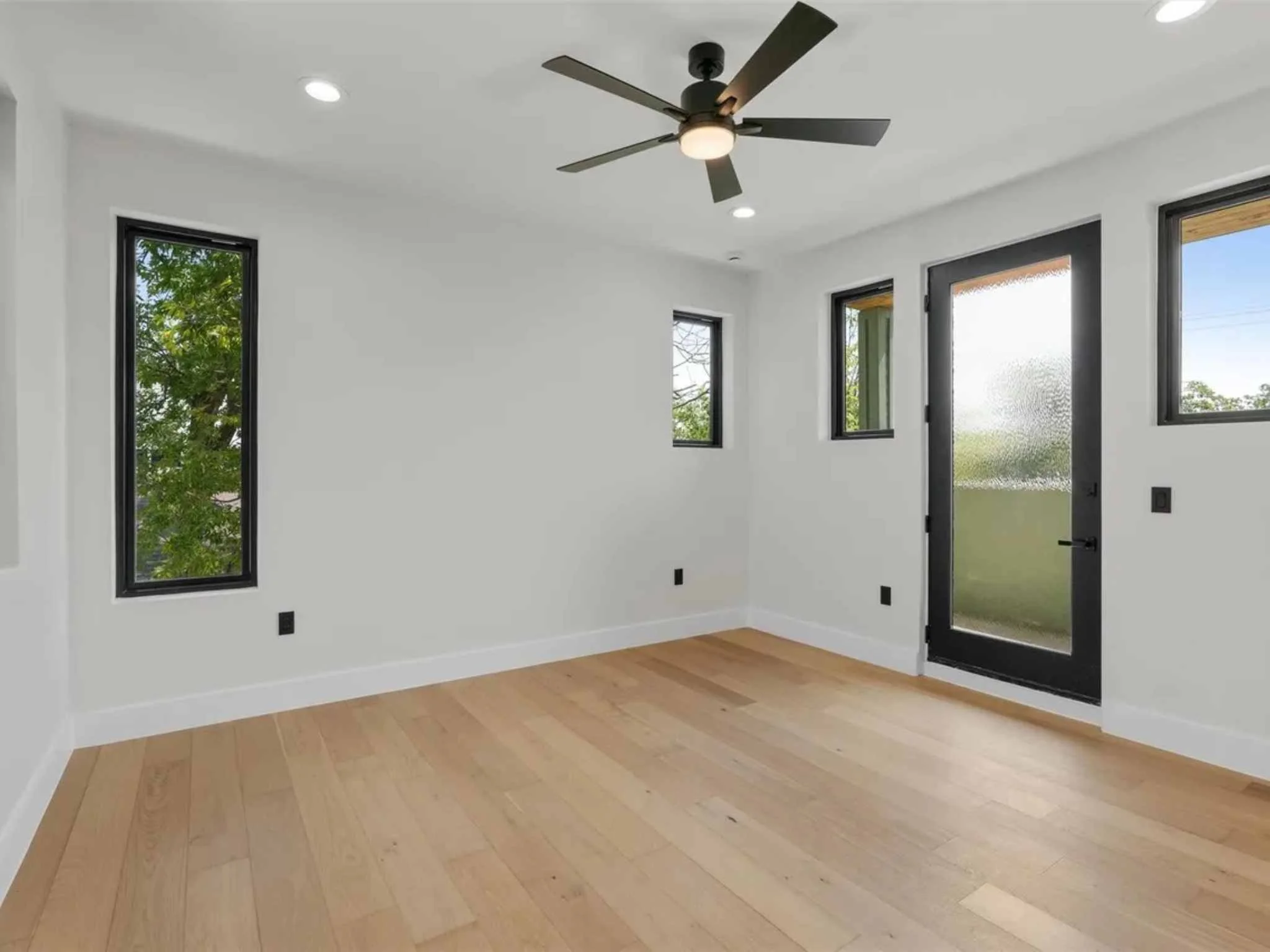 Primary bedroom in a downtown Austin custom home by Atria Design and Build.