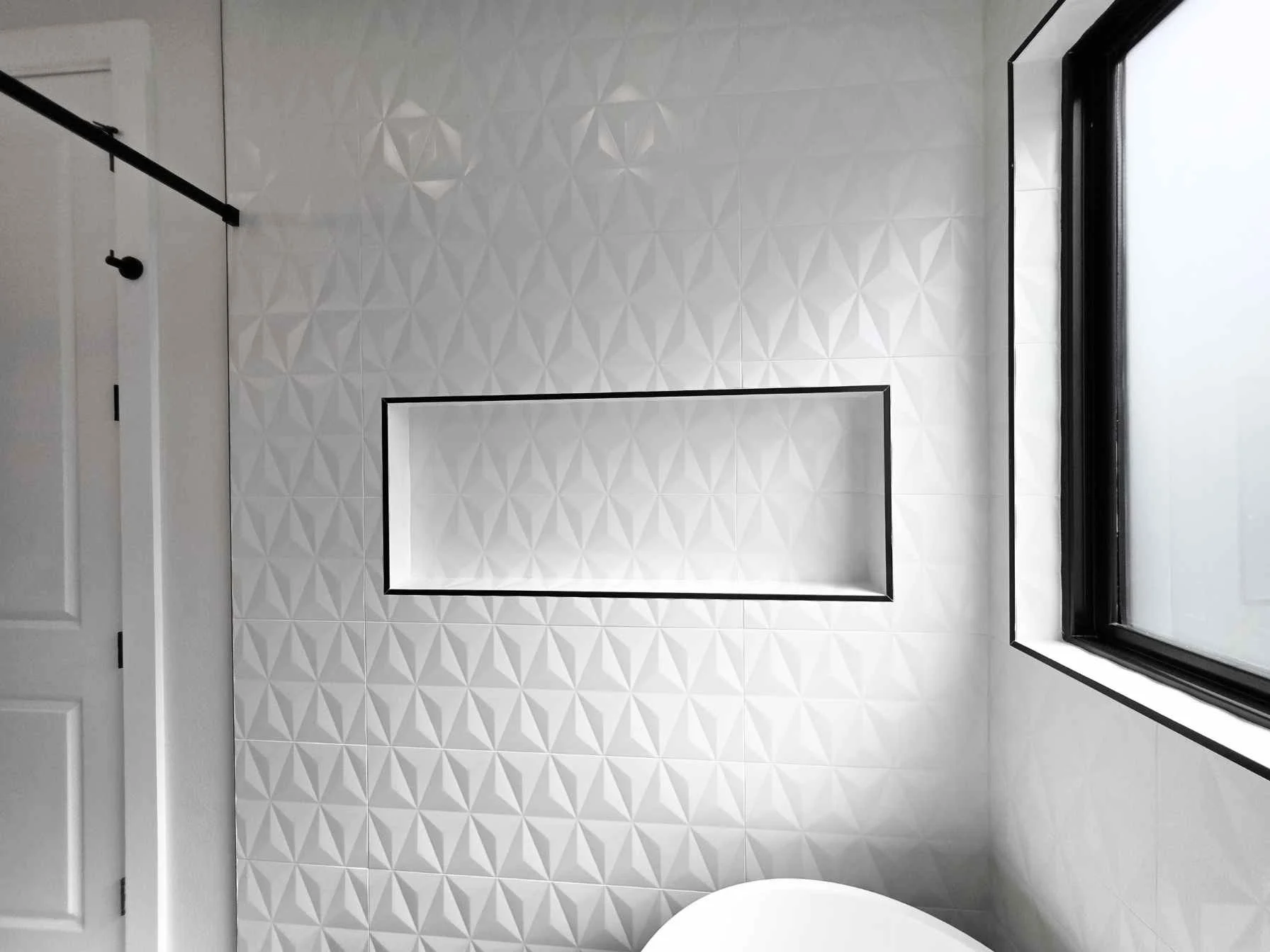 Custom bathroom in a downtown Austin ADU by Atria Design and Build.