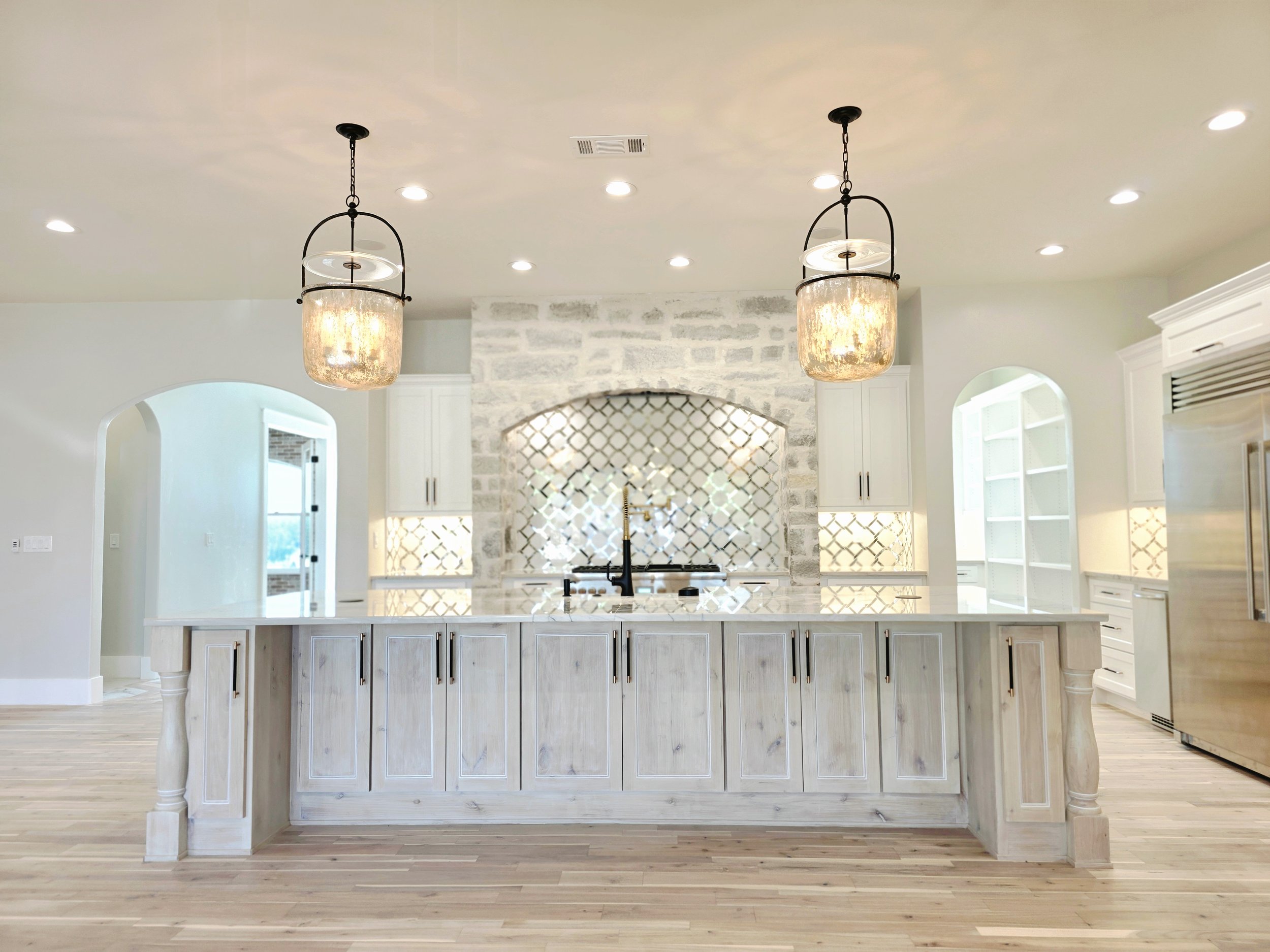 Kitchen remodel takeover in Liberty Hill Texas with Hardwood floors and custom island