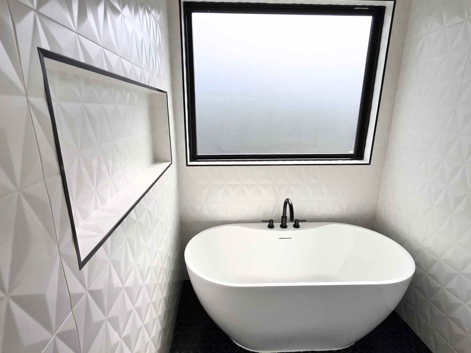 Custom bathroom in a downtown Austin ADU by Atria Design and Build.