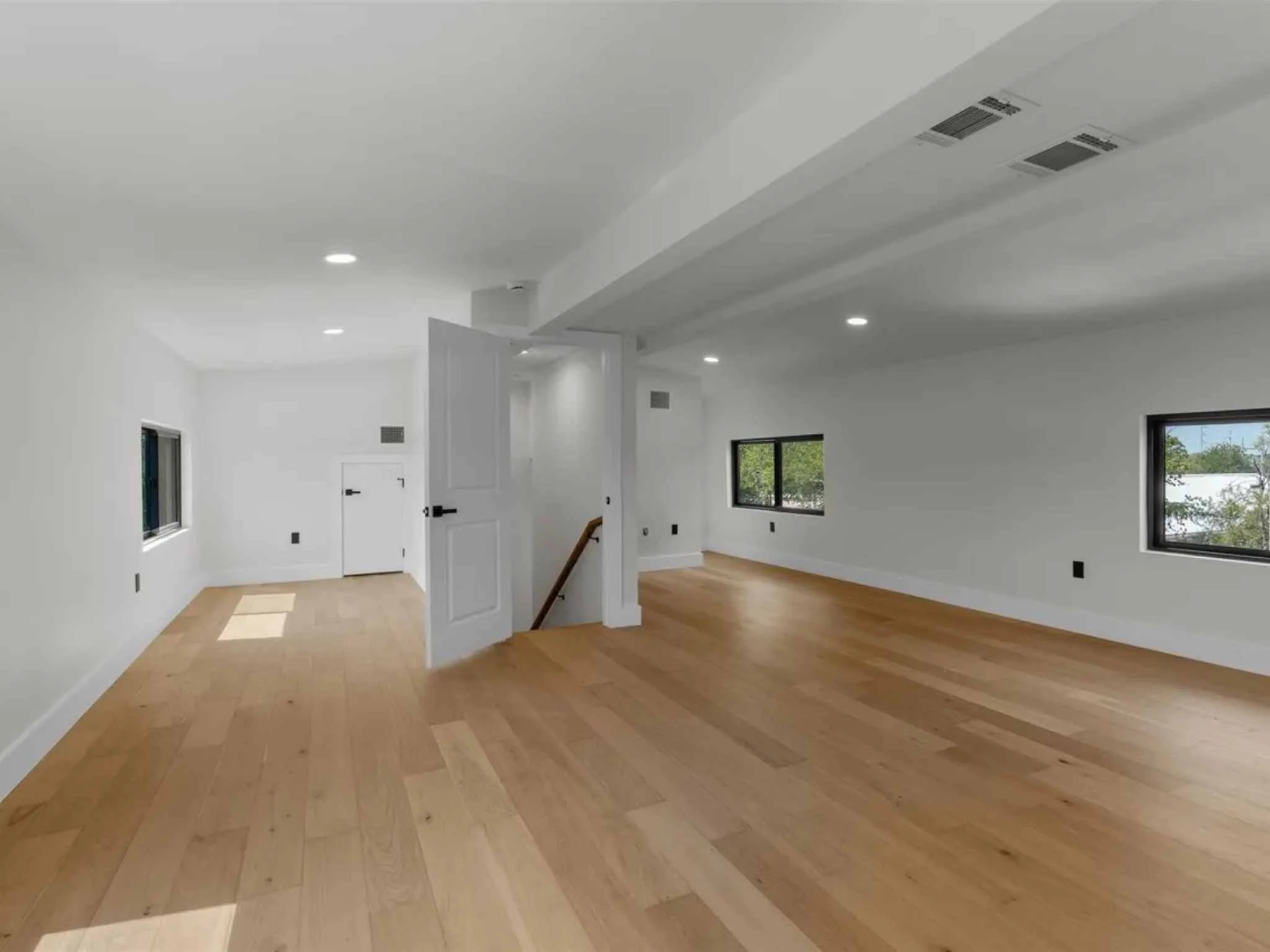 Open loft area in a downtown Austin custom home by Atria Design and Build.