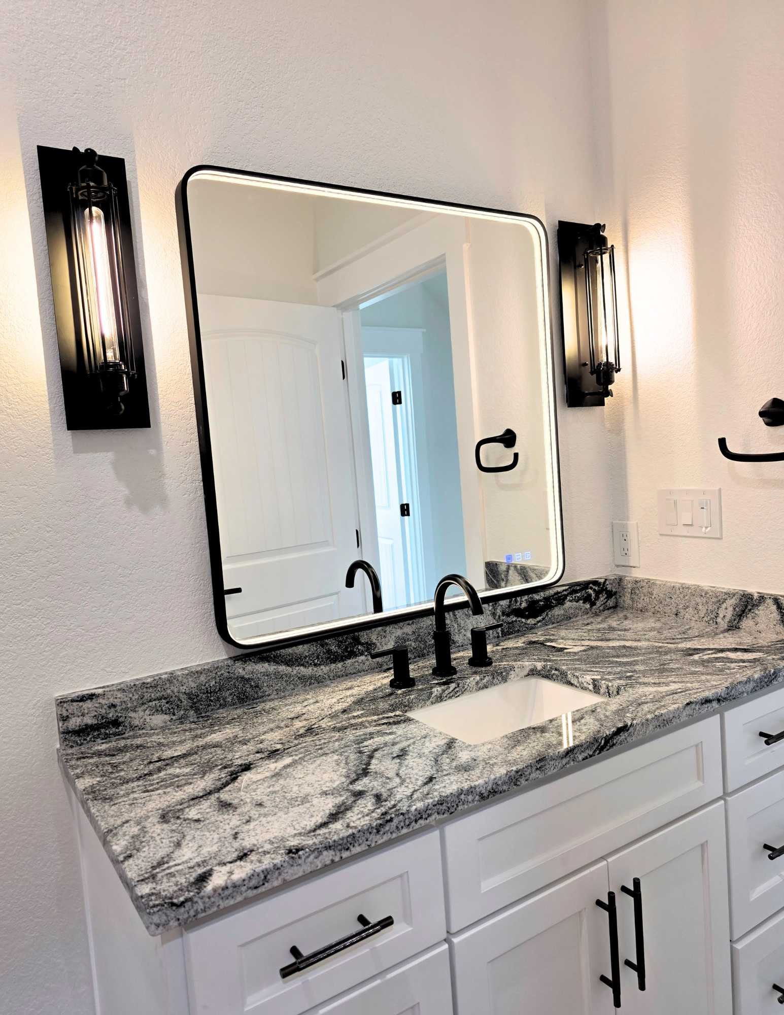 Bathroom vanity with Marble countertops, LED lights, custom cabinets