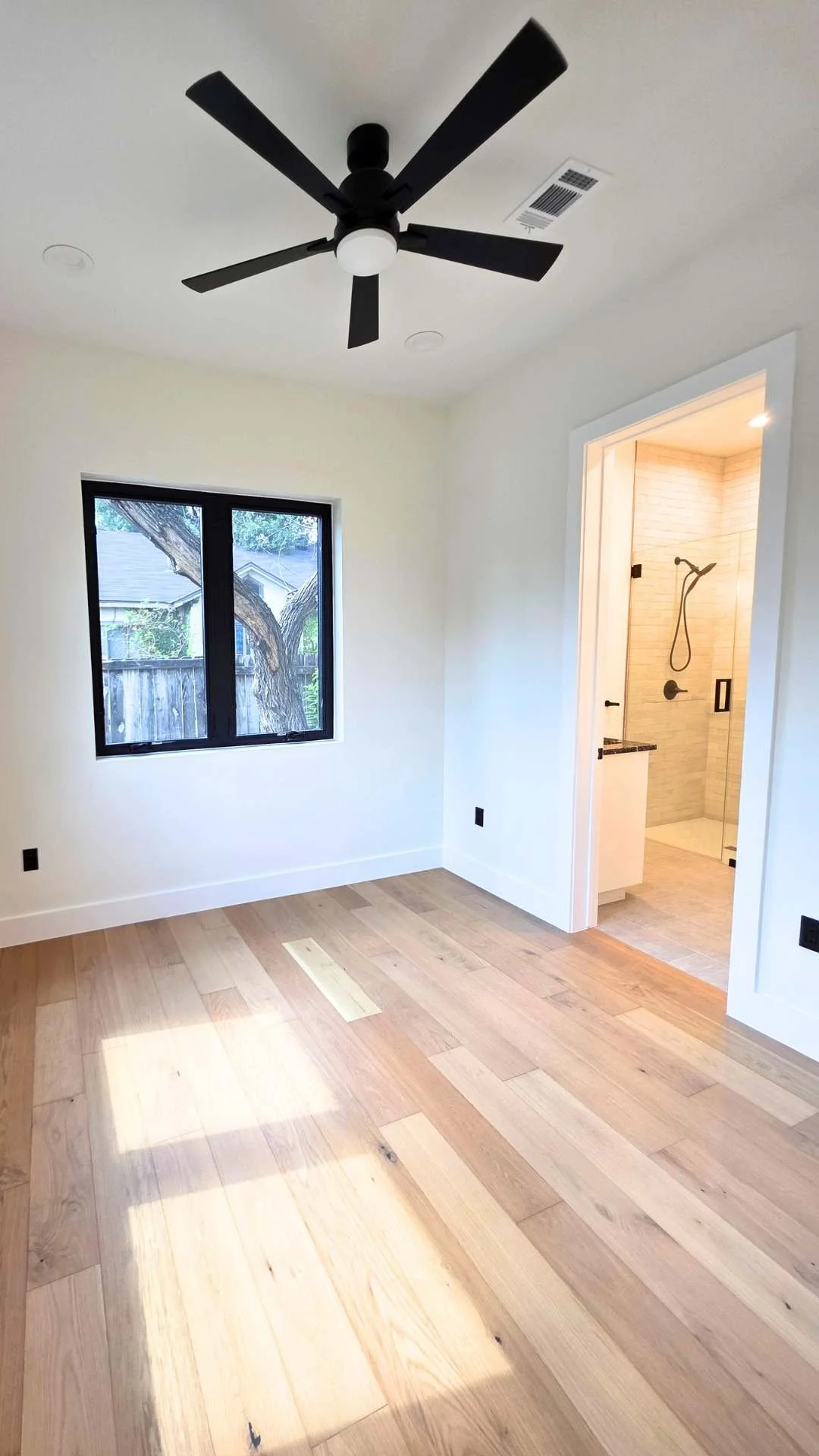 Bedroom in a downtown Austin ADU by Atria Design and Build.