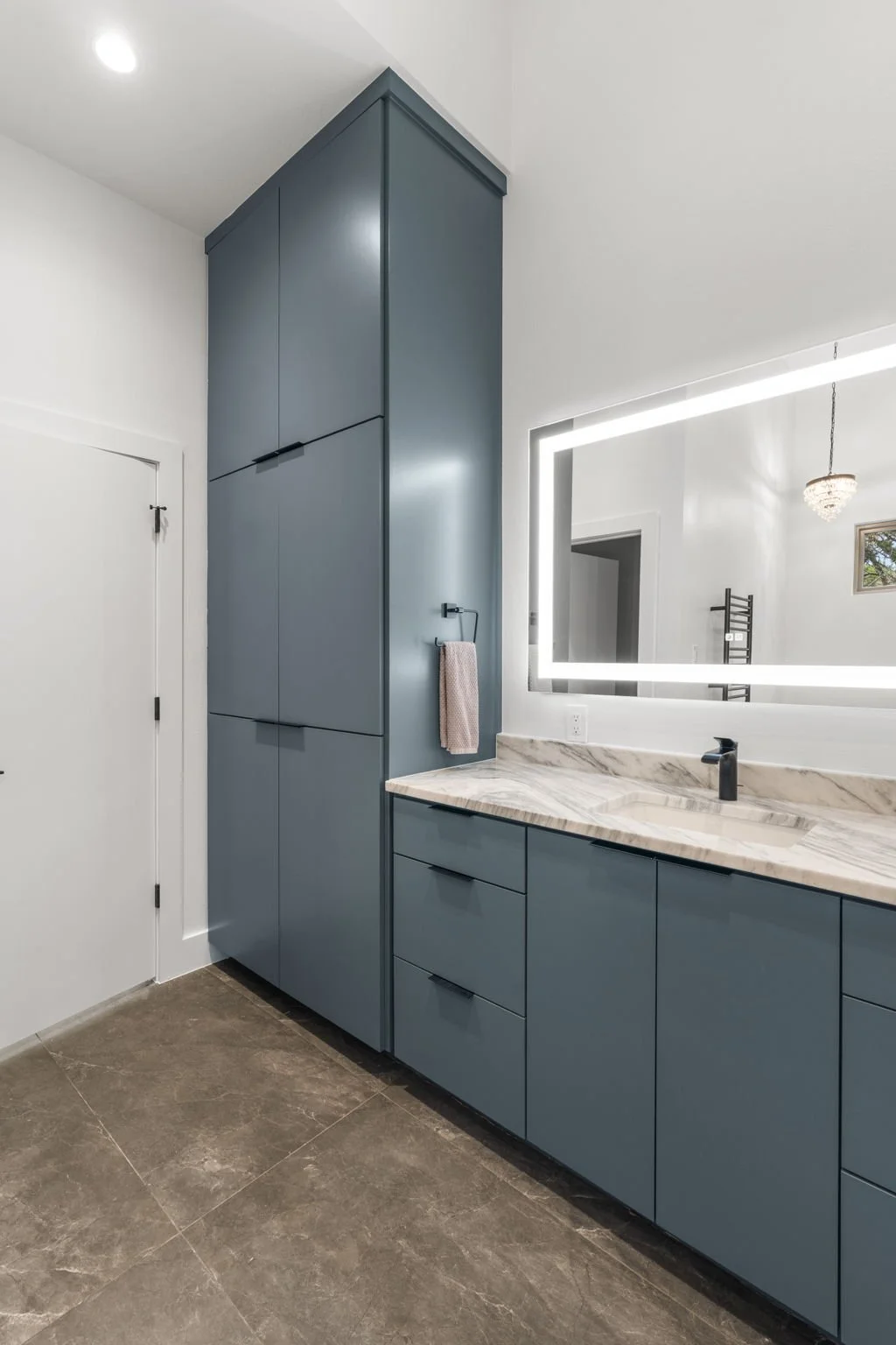 Custom bathroom remodel featuring Brazilian Carrara marble and sleek modern finishes.