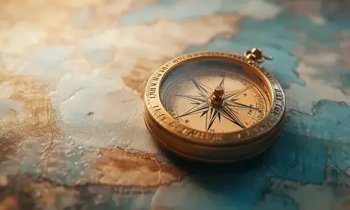 Elegant gold compass resting on a vintage world map, symbolizing custom-curated travel planning.