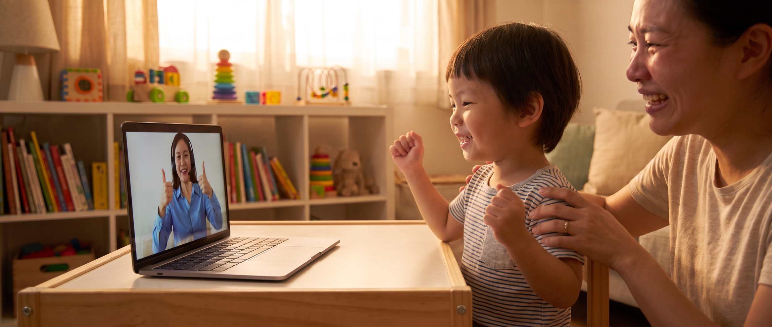 Child and caregiver celebrating progress during telehealth speech therapy session