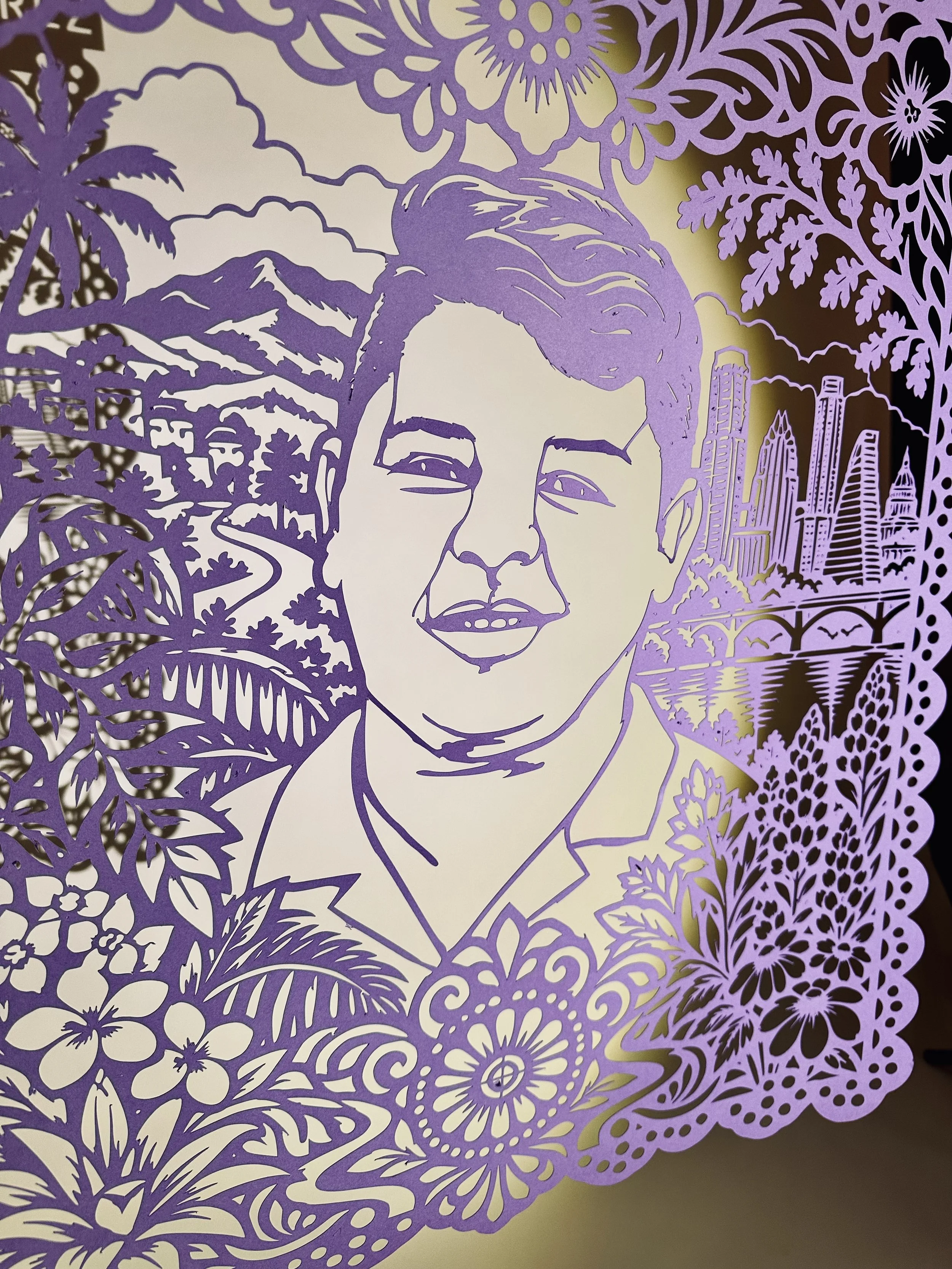 Detail of Wilber Rafael Garcés Pérez’s Papel Memoria portrait showing Lady Bird Lake and the Austin skyline.
