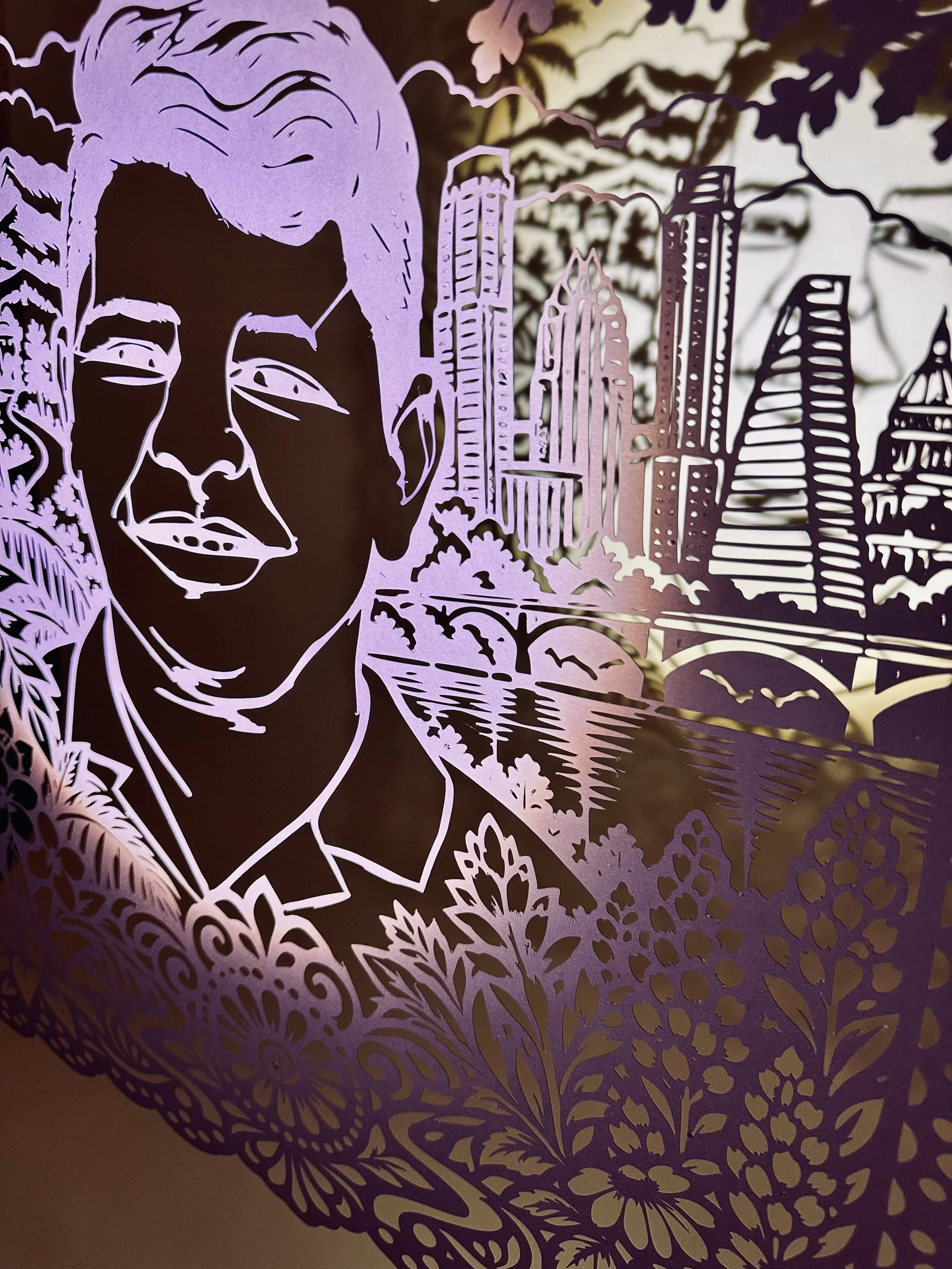 Close detail of Wilber Rafael Garcés Pérez’s papel picado portrait showing Austin city skyline.
