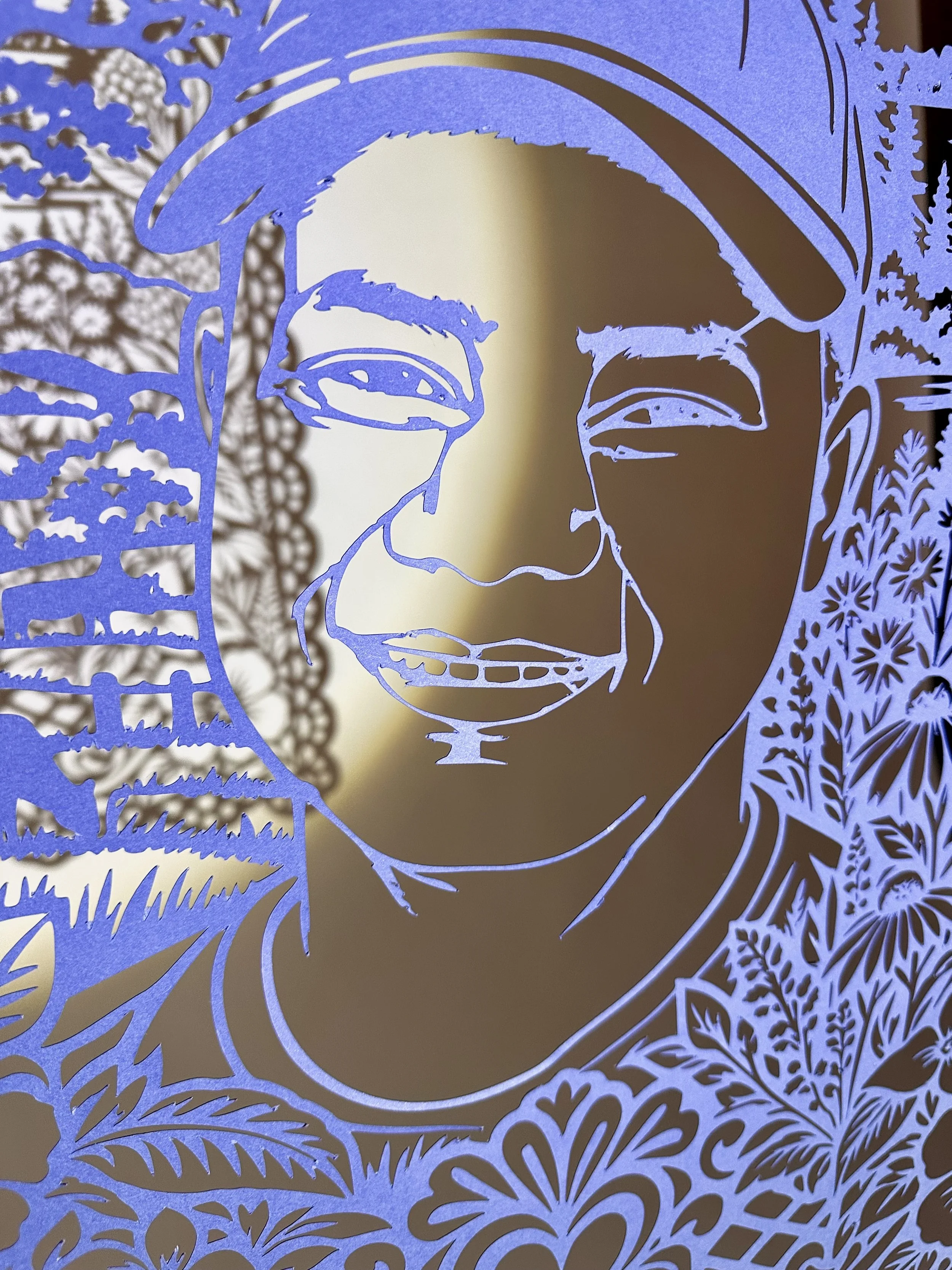 Detail of Carlos Josué Marchena Marchena’s Papel Memoria portrait showing Michigan woodland, water and native wildflowers.
