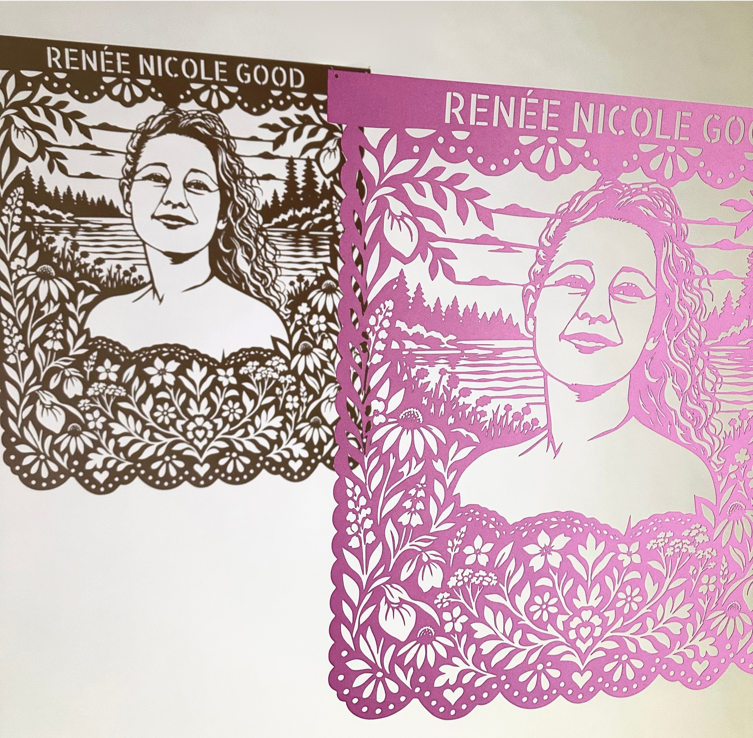 Detail of Renee Nicole Good’s Papel Memoria portrait showing a Minnesota lake, evergreen forest and native wildflowers with shadow of the portrait on the wall..