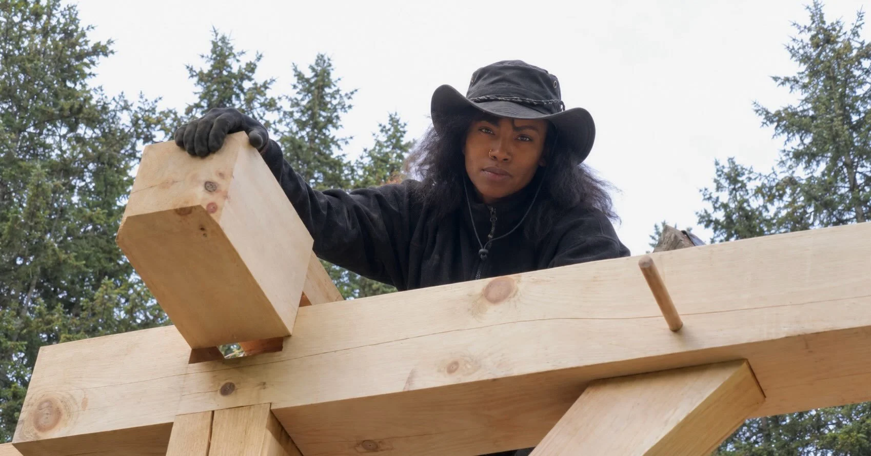 Ashley studies how things are built, and it shows up in how every Anderson North kit is designed.

This is a traditional timber frame: a mortise cut by hand, a tenon, and a wooden peg locking the joint. It isn&rsquo;t what we sell. Our kits are frame