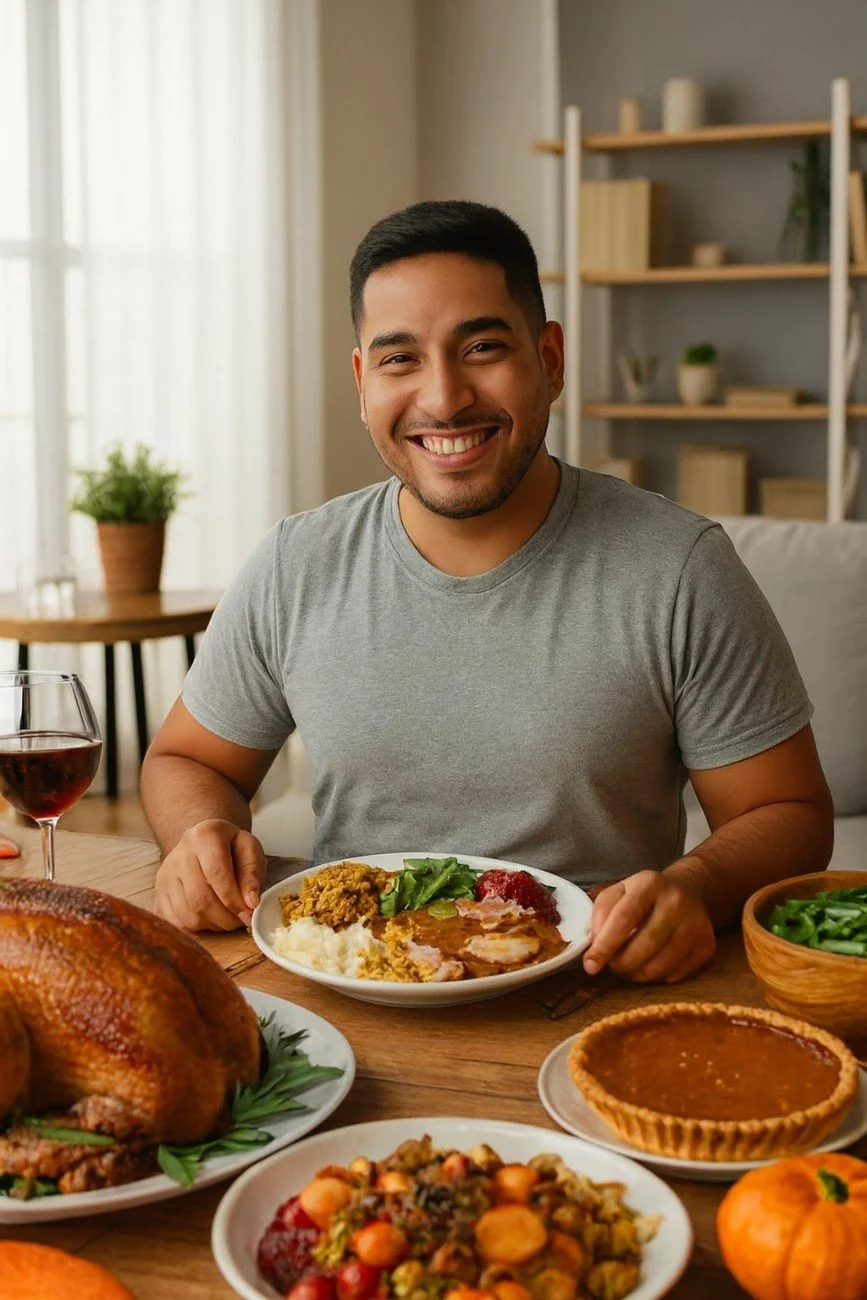 A middle-aged man smiles with relaxed posture at a Thanksgiving table, illustrating relief and recovery from digestive discomfort.