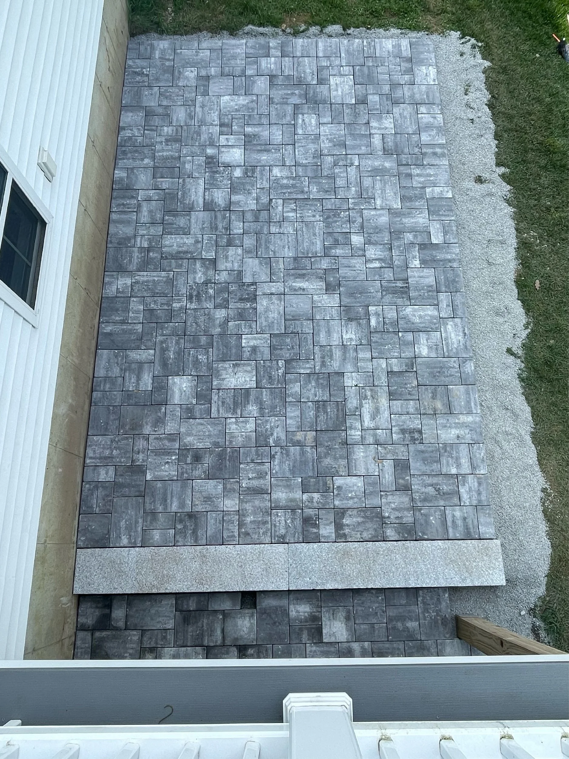 Large two-tier limestone patio built by The Englishmen Masonry in Portsmouth, NH