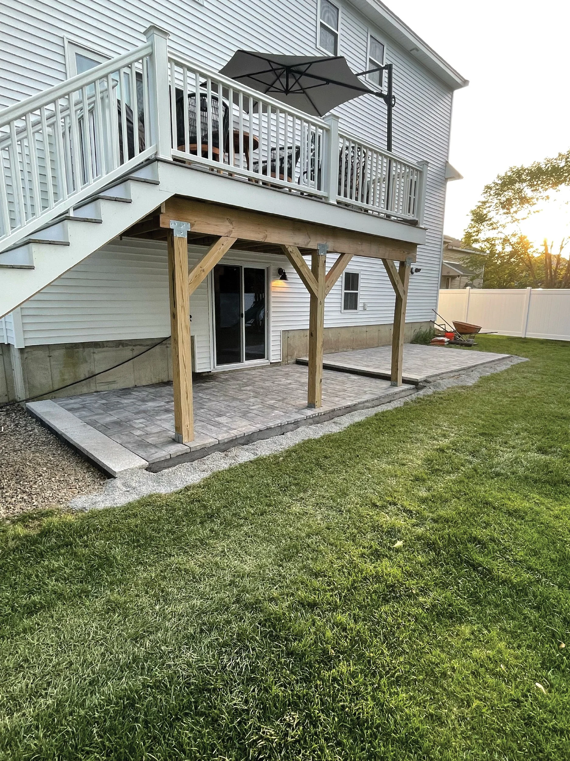 Large two-tier limestone patio built by The Englishmen Masonry in Portsmouth, NH