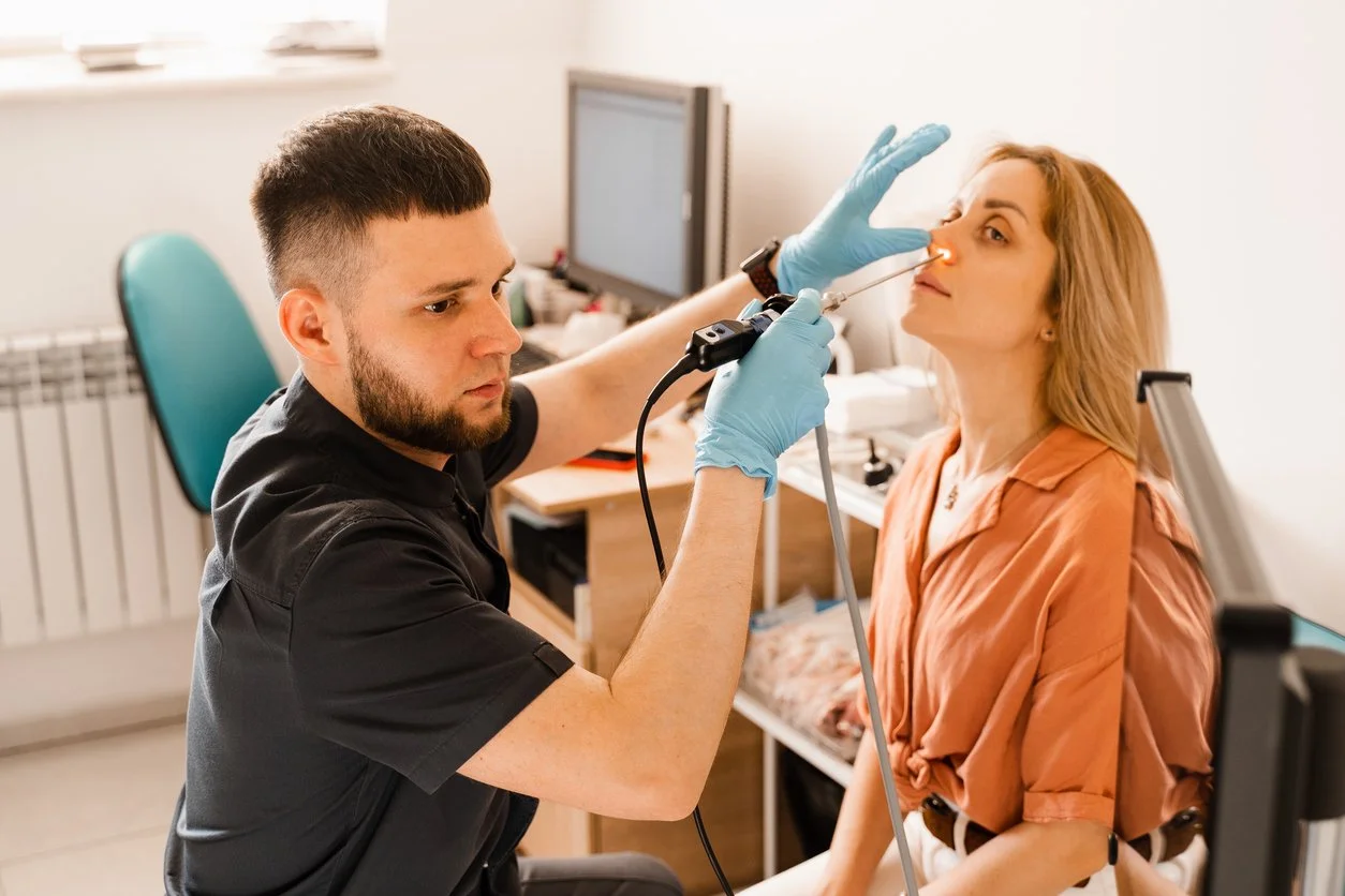Speech Therapist for adults in Maui, HI performing a swallowing evaluation (FEES) using a nasal camera.