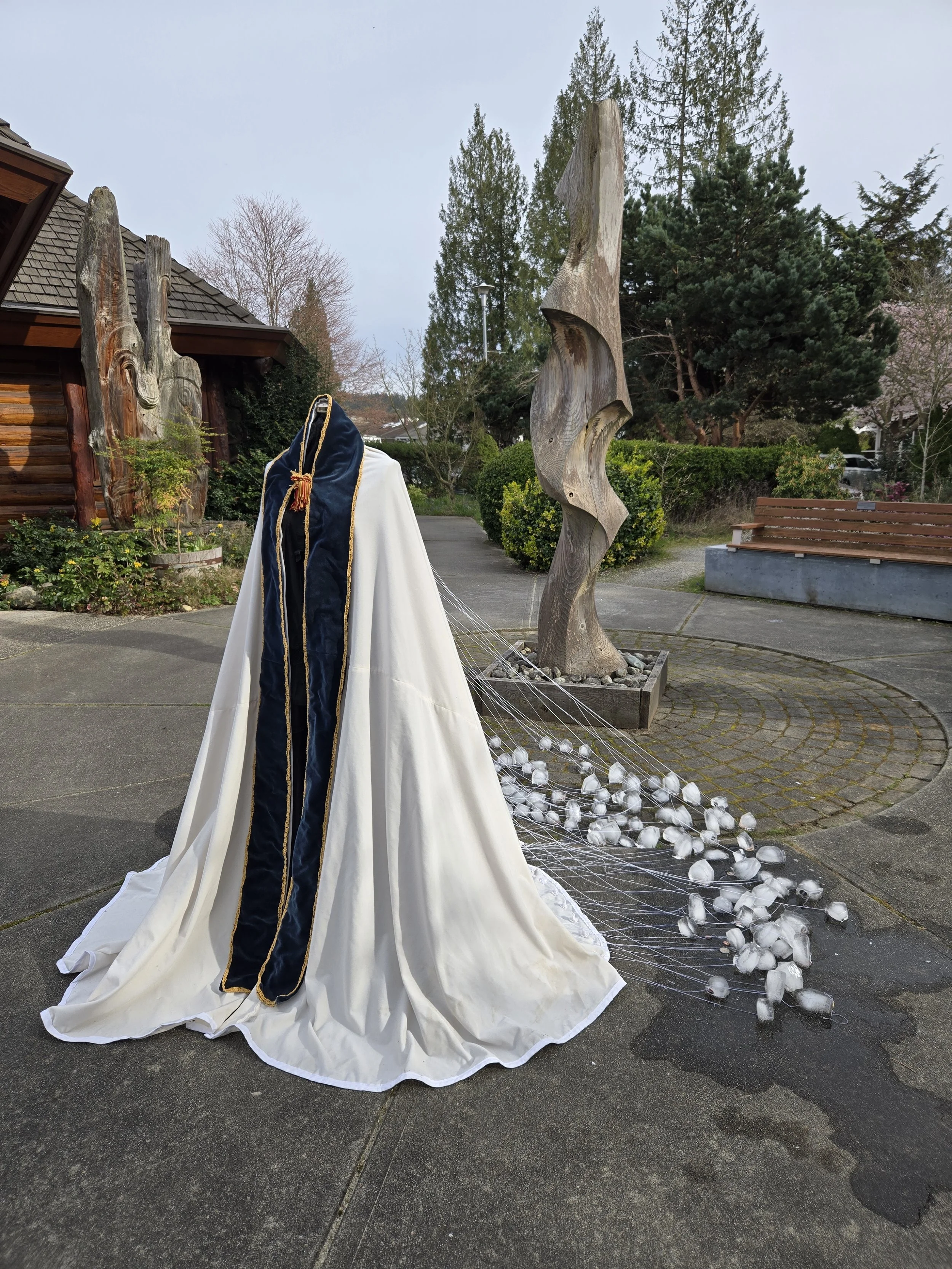 We Are All Witness, repurposed fabric, thread, knitted paper yarn (on back), ice, coins