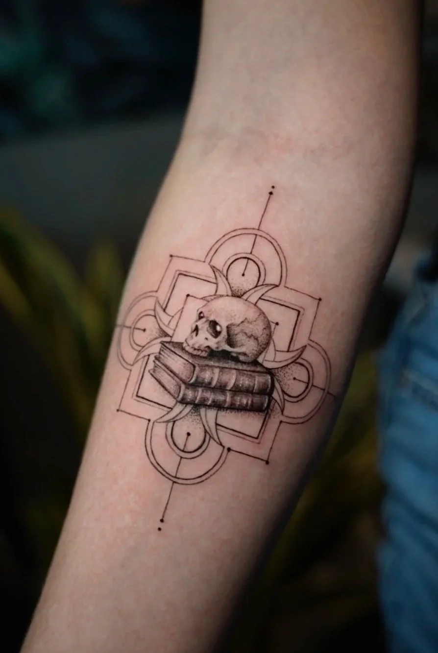 Black and grey skull books geometric tattoo by Luis D Art Charlotte