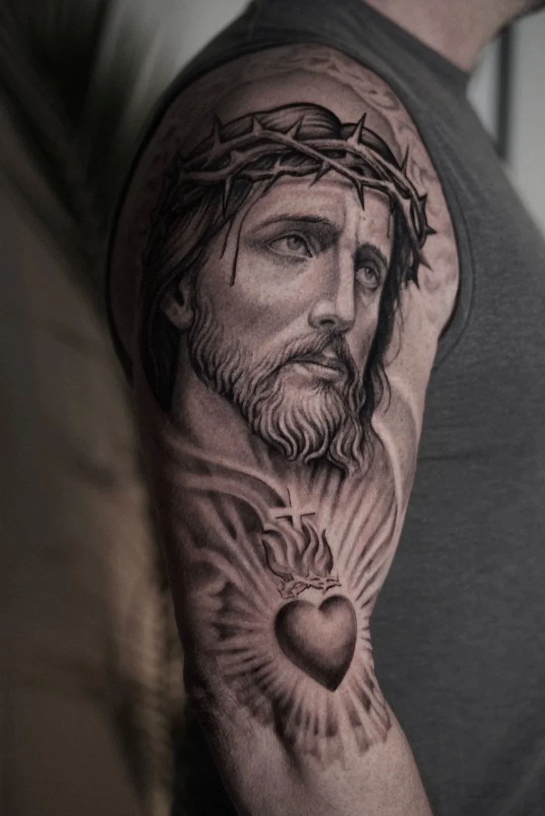 
Black and grey lager Jesus realism tattoo by Luis D Art in Charlotte NC