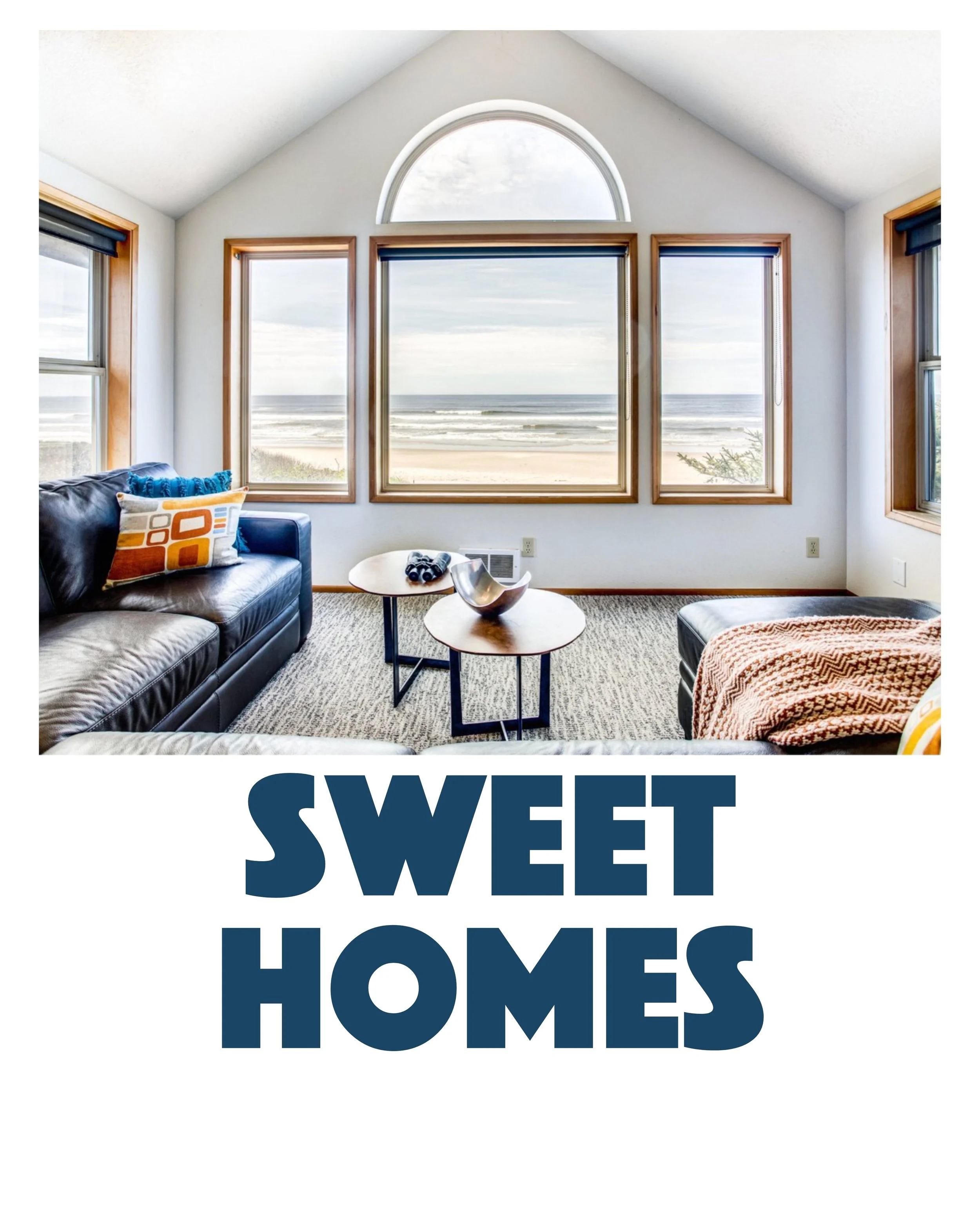 Living room with large windows overlooking the beach, sofa, armchair, and coffee table and the text Sweet Homes Rentals Below