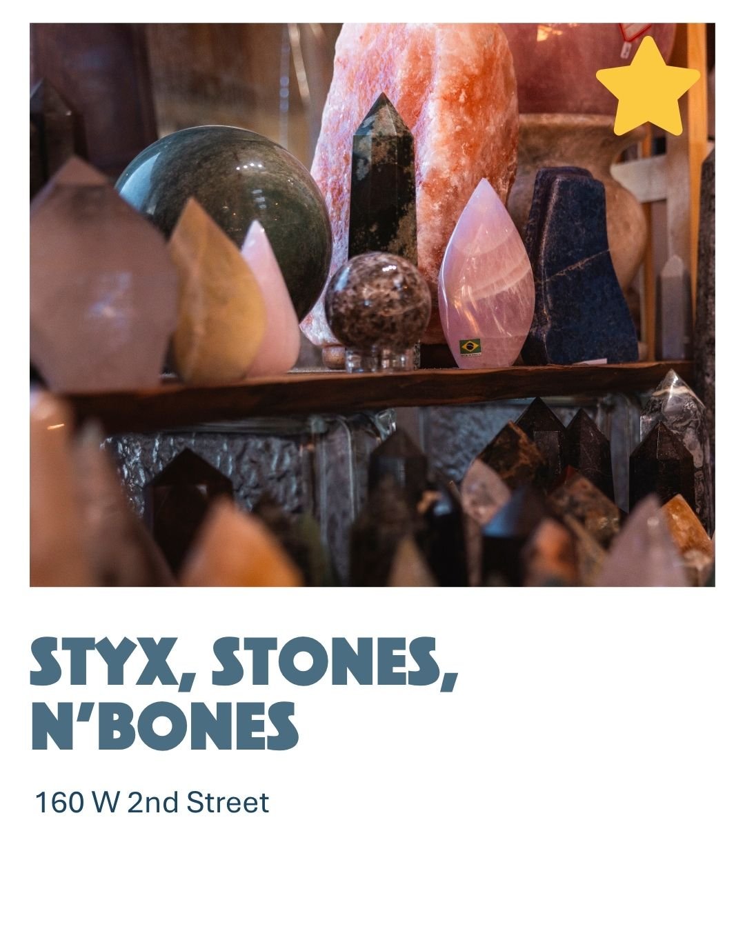 A display of various decorative stones and crystals of different shapes, sizes, and colors on shelves in a shop.