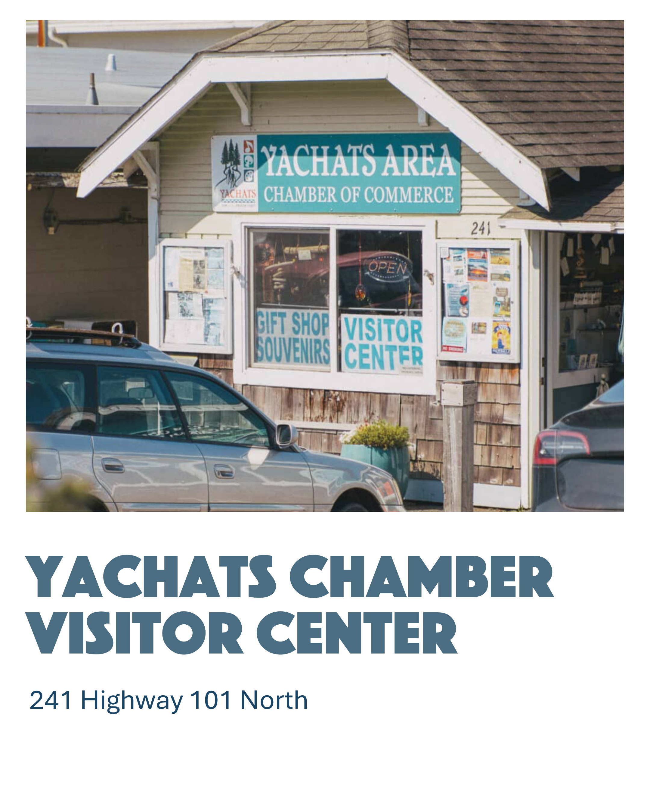 Exterior of a building with a sign that reads "Yachats Area Chamber of Commerce," featuring an illustration of trees and ducks, with notices and signs in the window advertising gift shop, souvenirs, and visitor center, and cars parked in front.