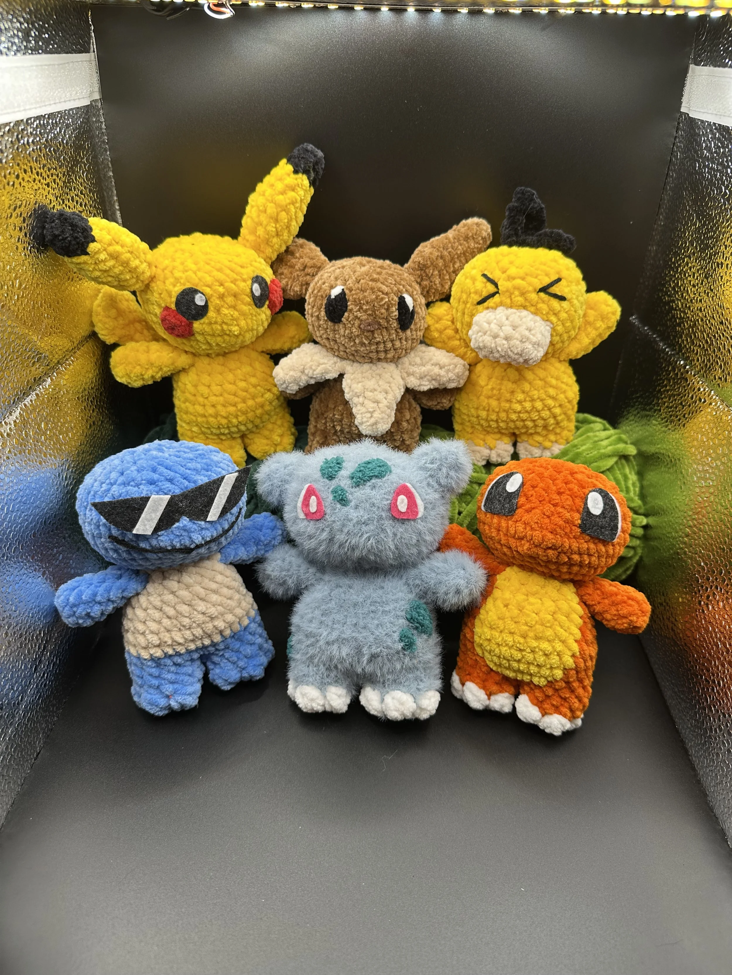 A group of crocheted pokémon