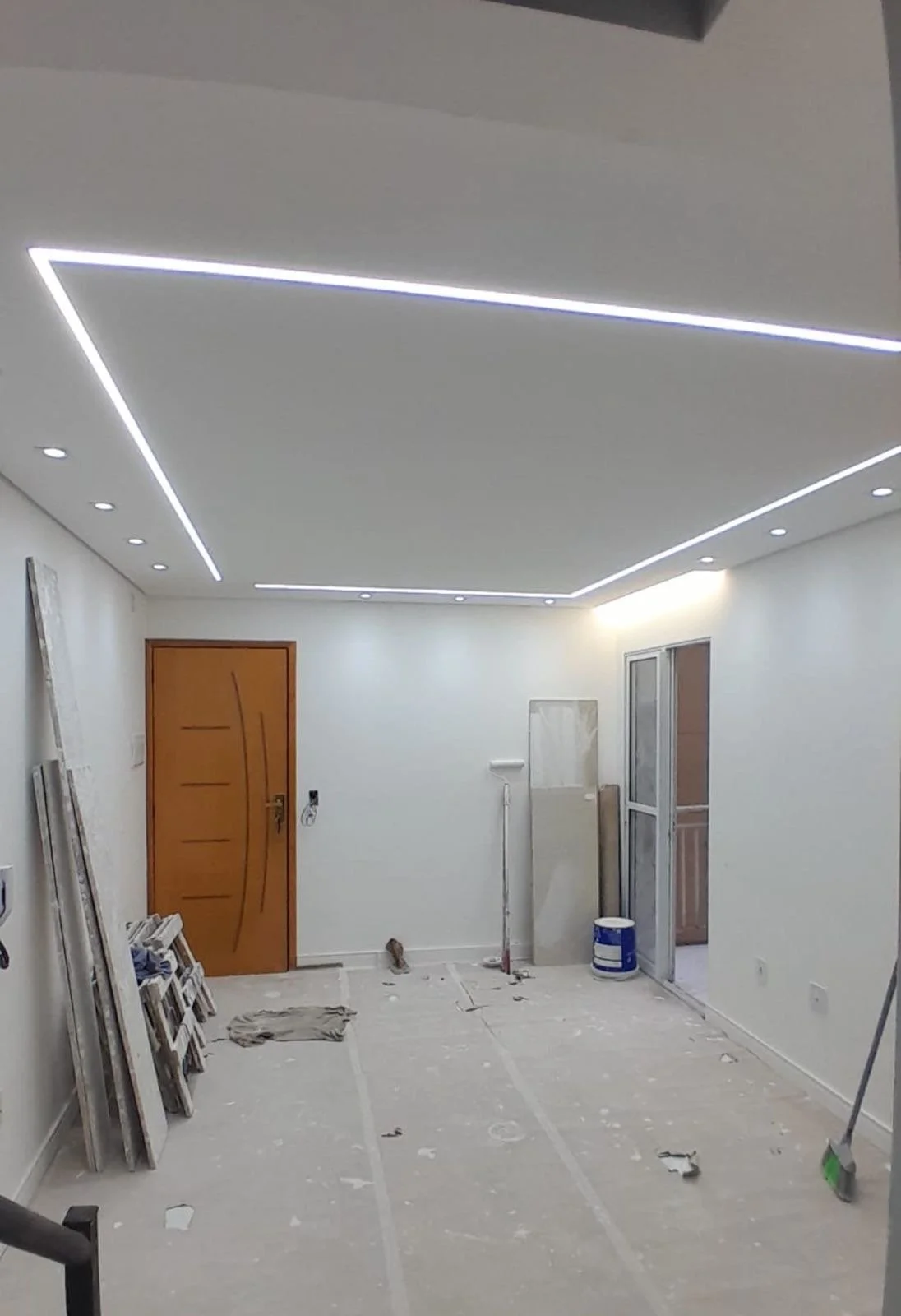 Gypsum ceiling with LED profile lighting at the home entrance, creating a welcoming first impression