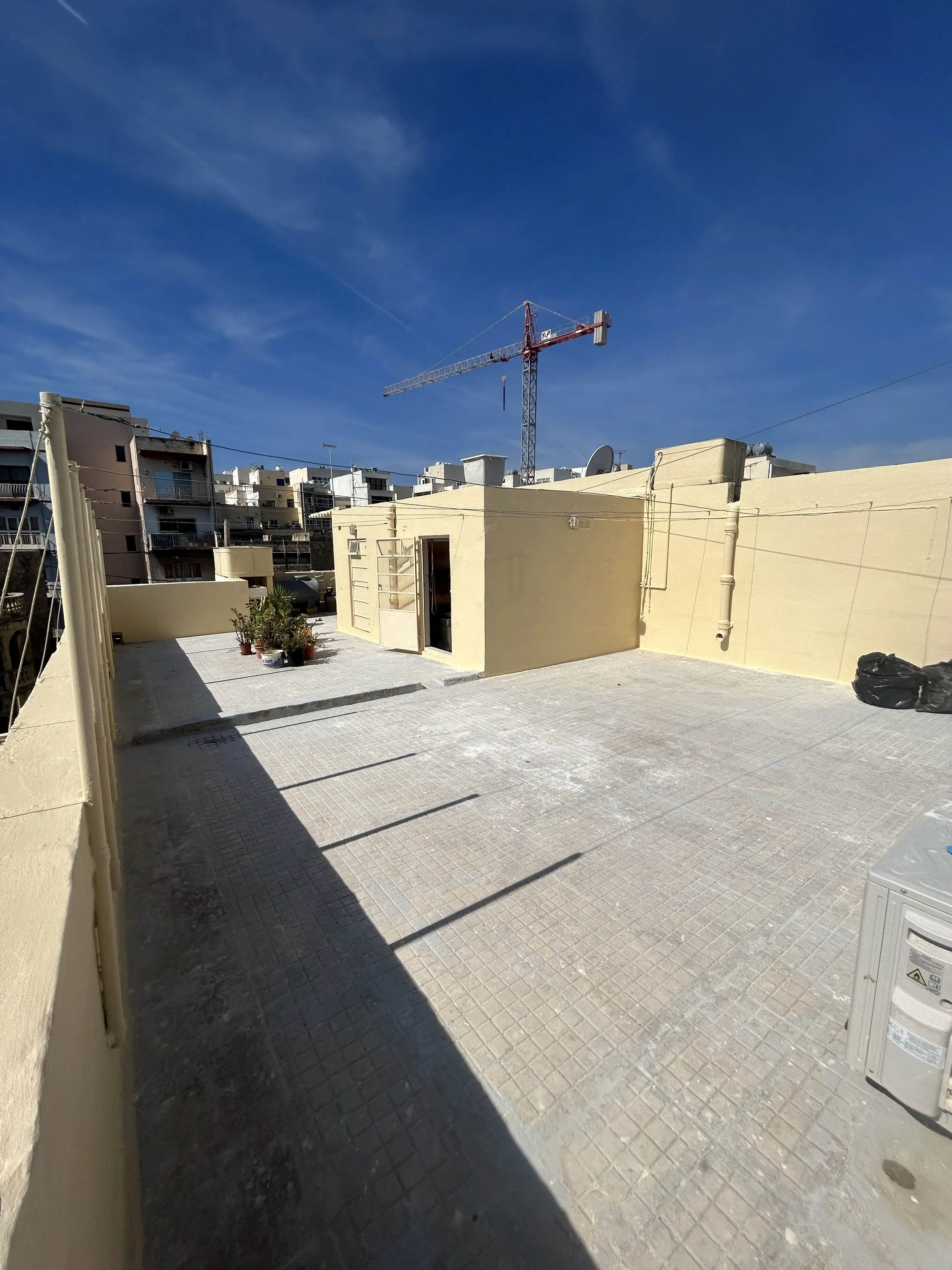 Roof walls waterproofed with mesh reinforcement and protective coating.