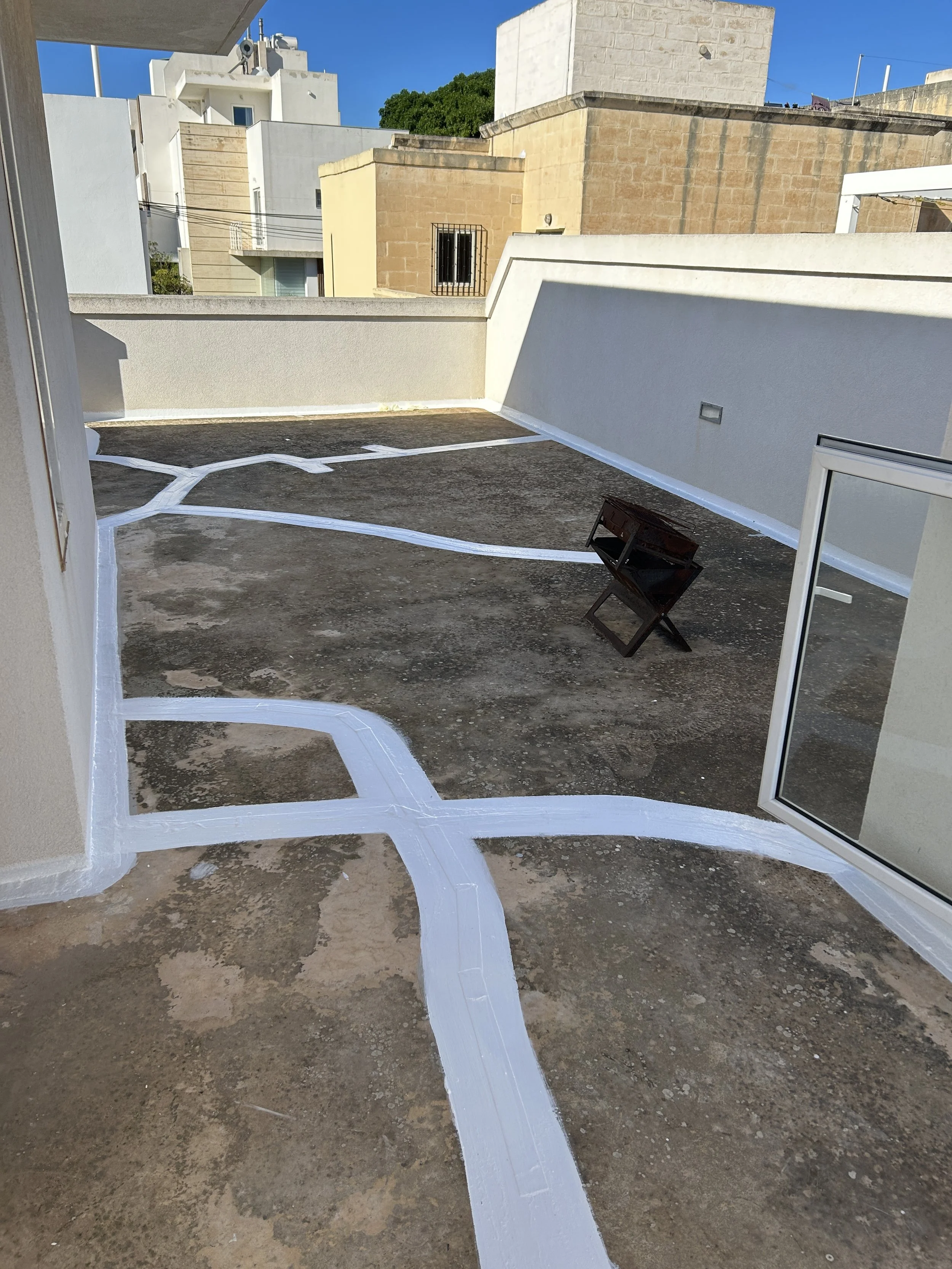Alternate view of liquid membrane and flashband applied to roof joints.