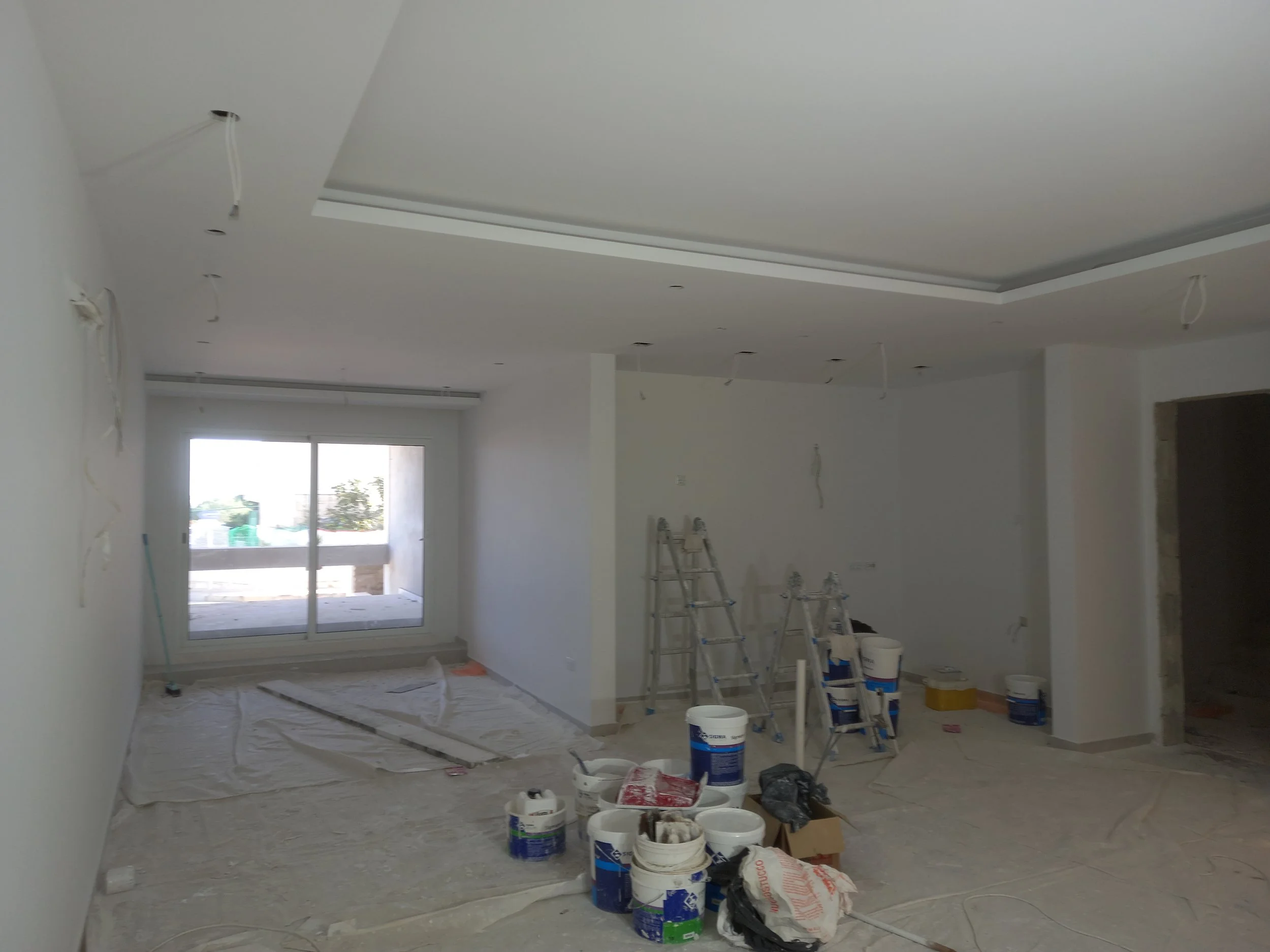 Flat gypsum ceiling idea in a modern kitchen, creating a clean and bright space in a Maltese home