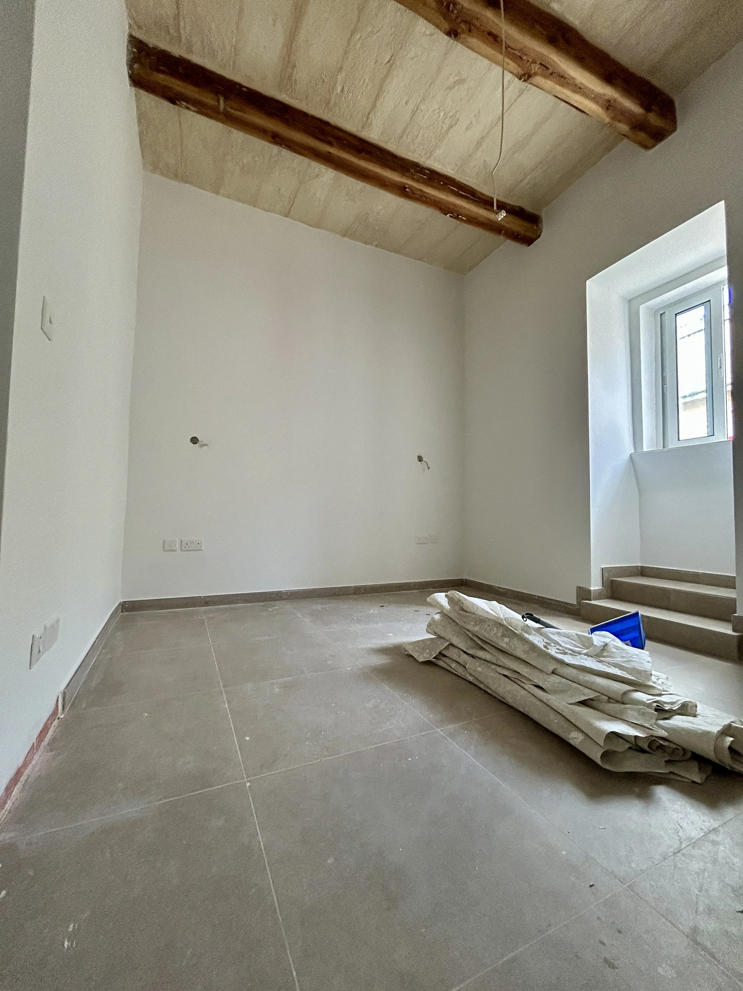 Bedroom painted in a clean white interior wall finish.