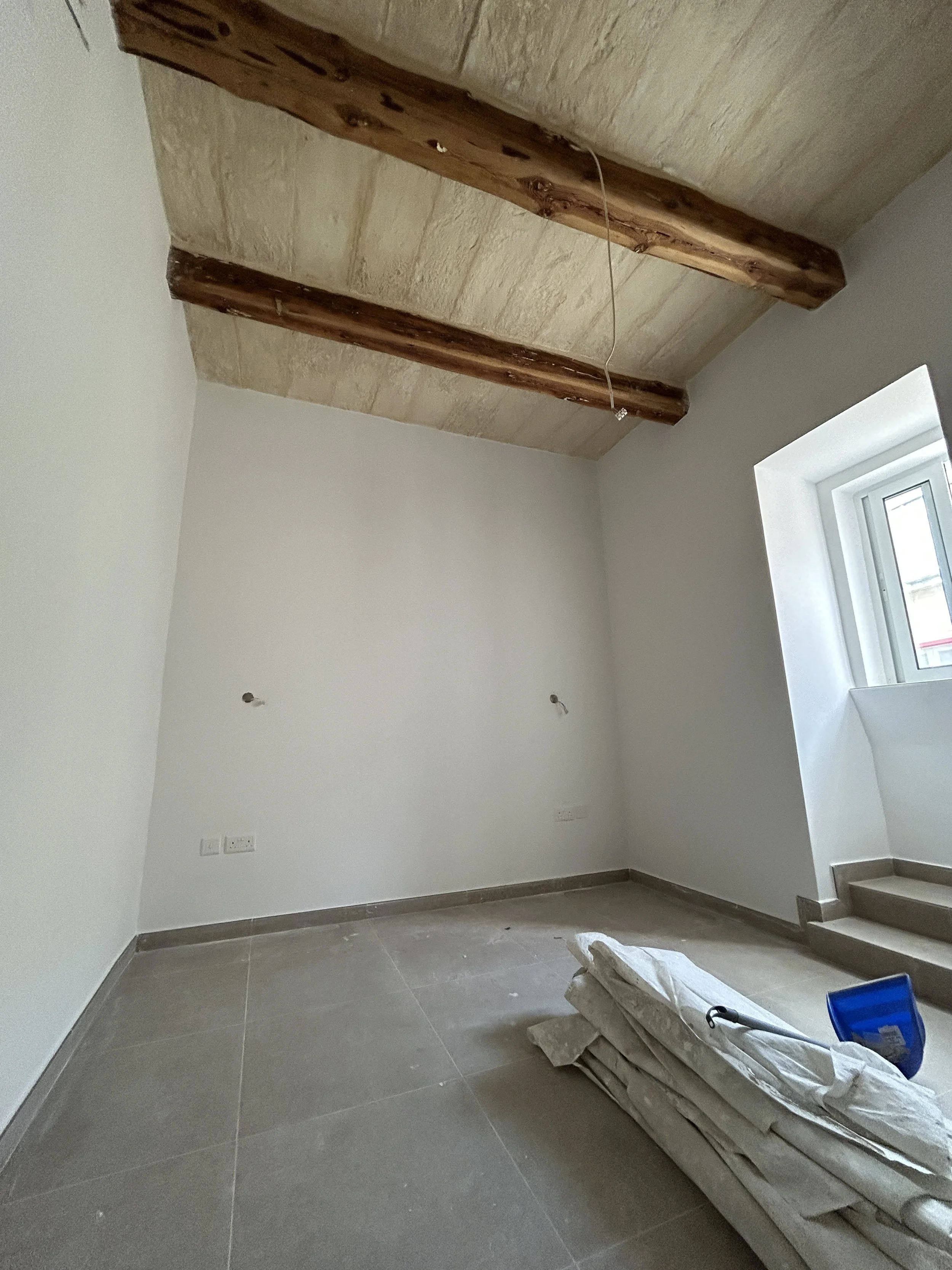 Interior smooth plastering completed in a bedroom ready for painting in Malta