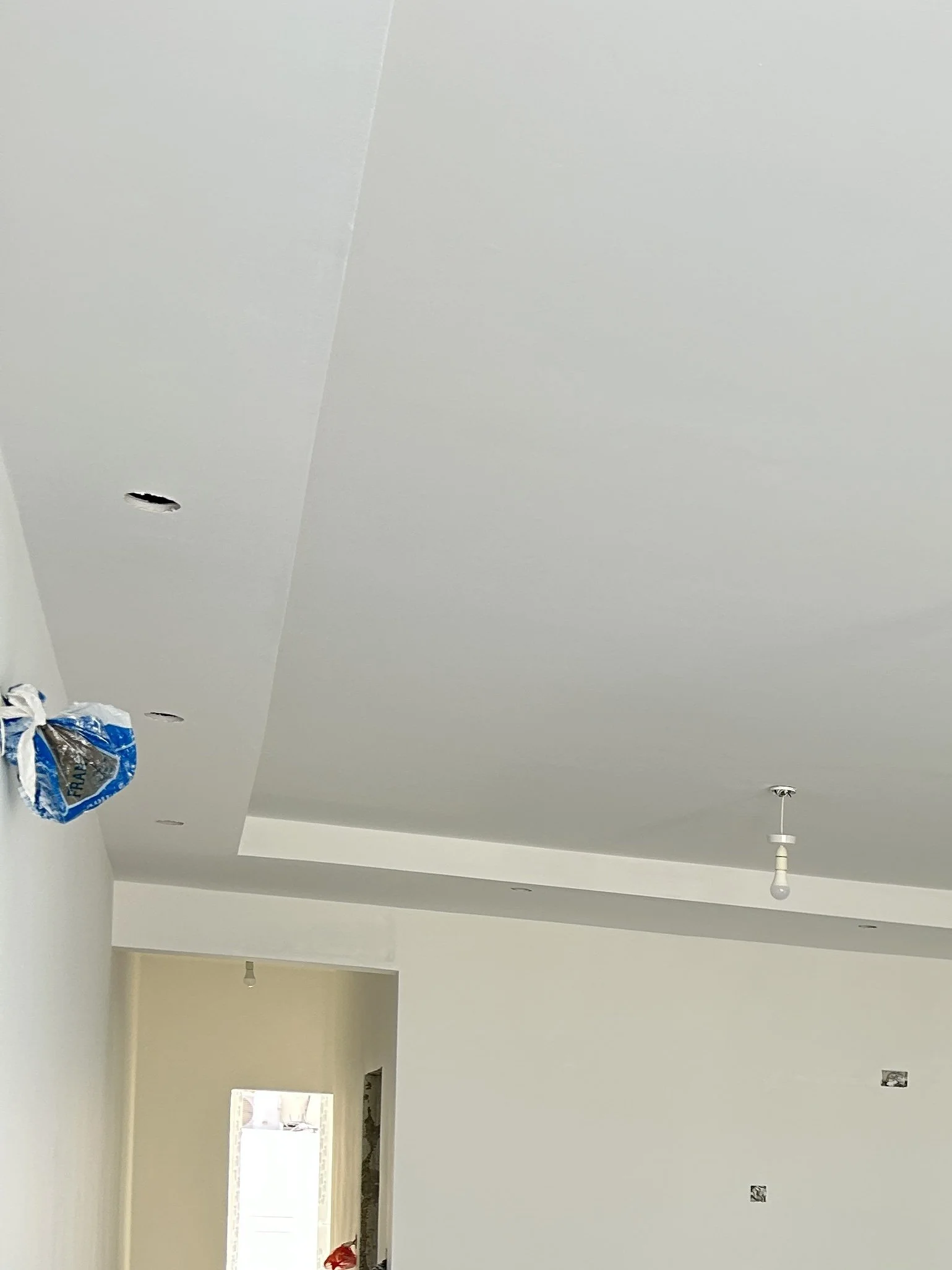Gypsum bulkhead design in an open plan living area, creating a clean and modern ceiling feature in a Maltese home