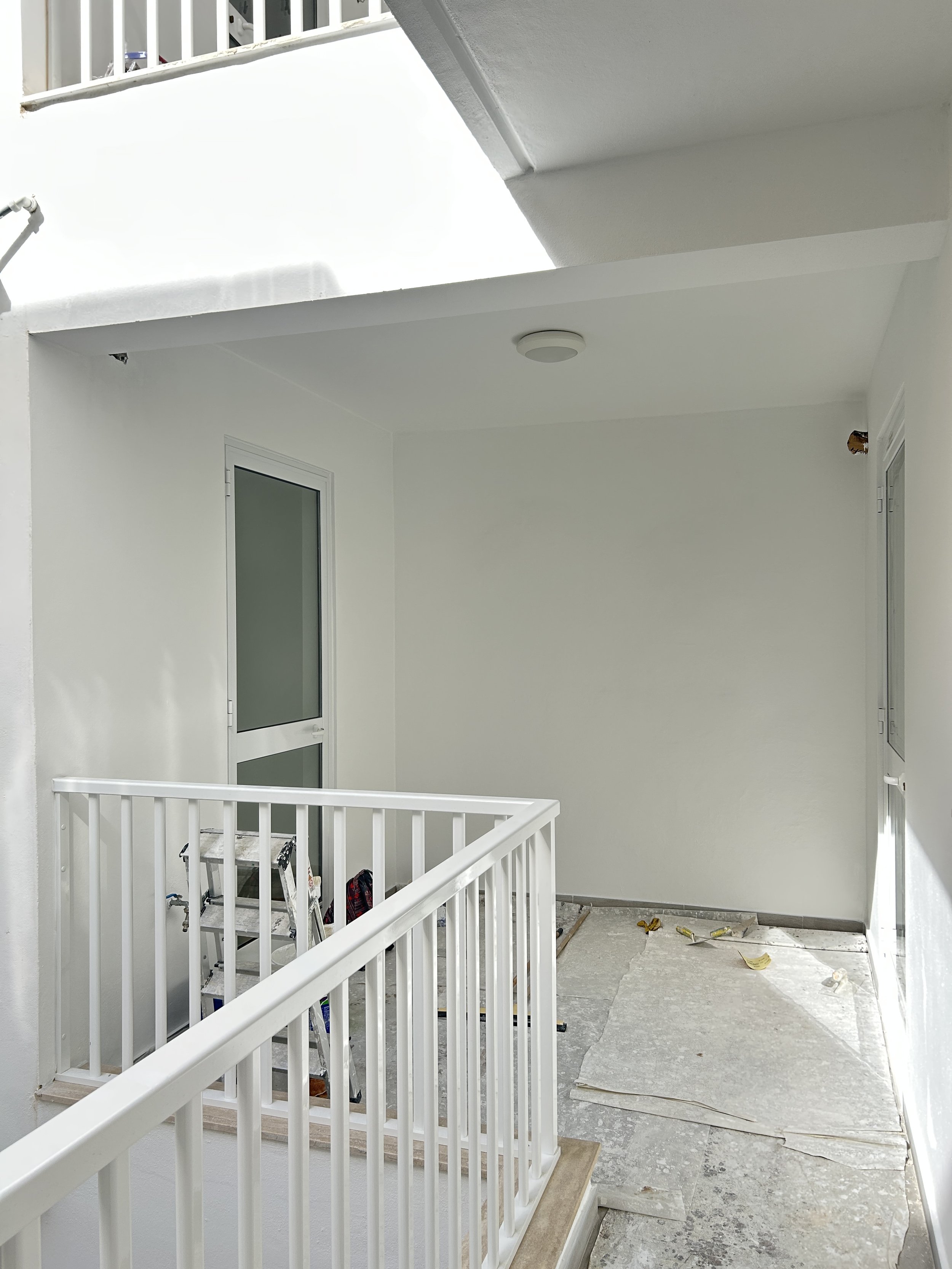Front terrace newly painted in a white exterior coating.