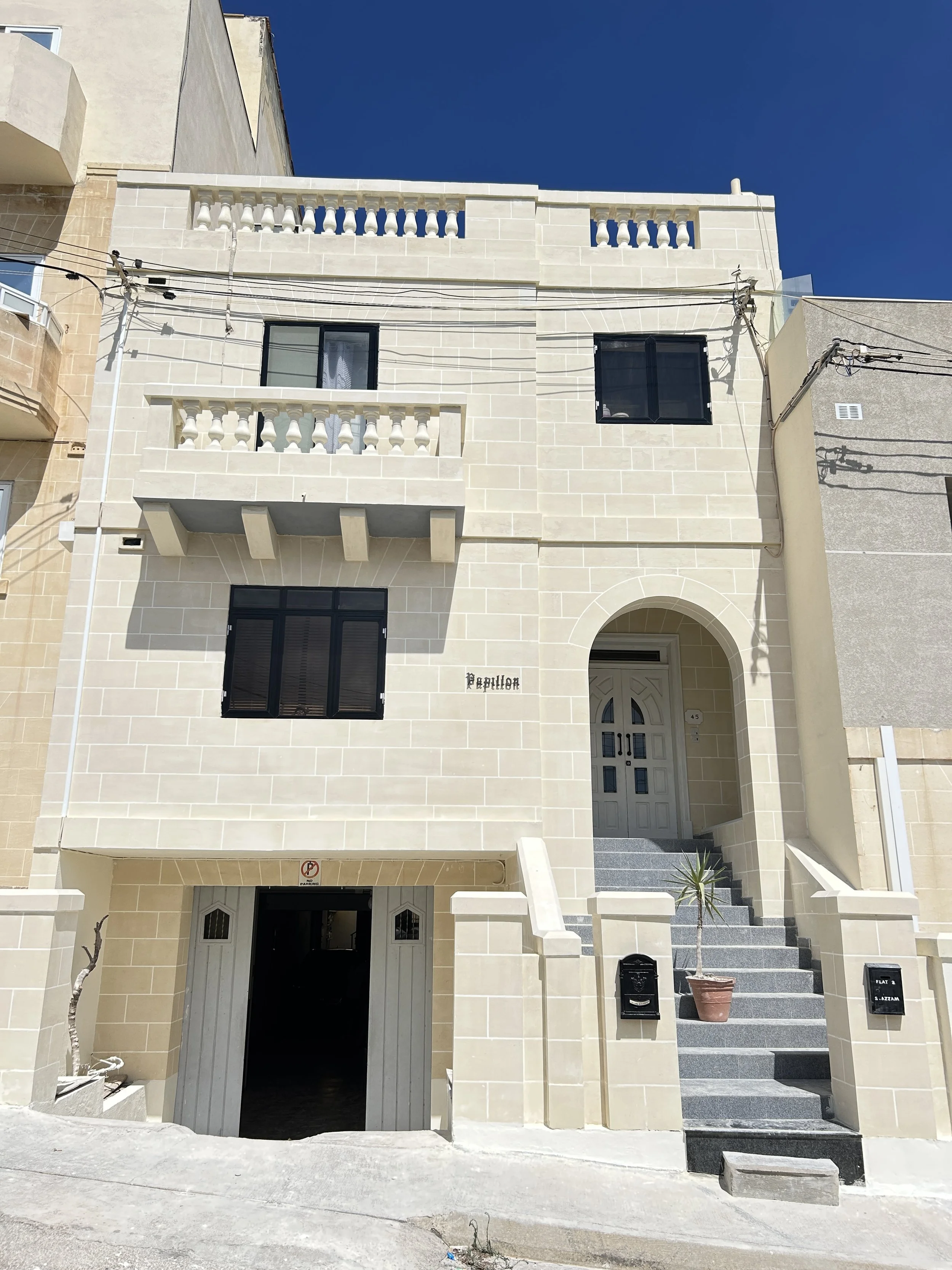 Fully renovated two-storey traditional Maltese fuq il-fil facade.