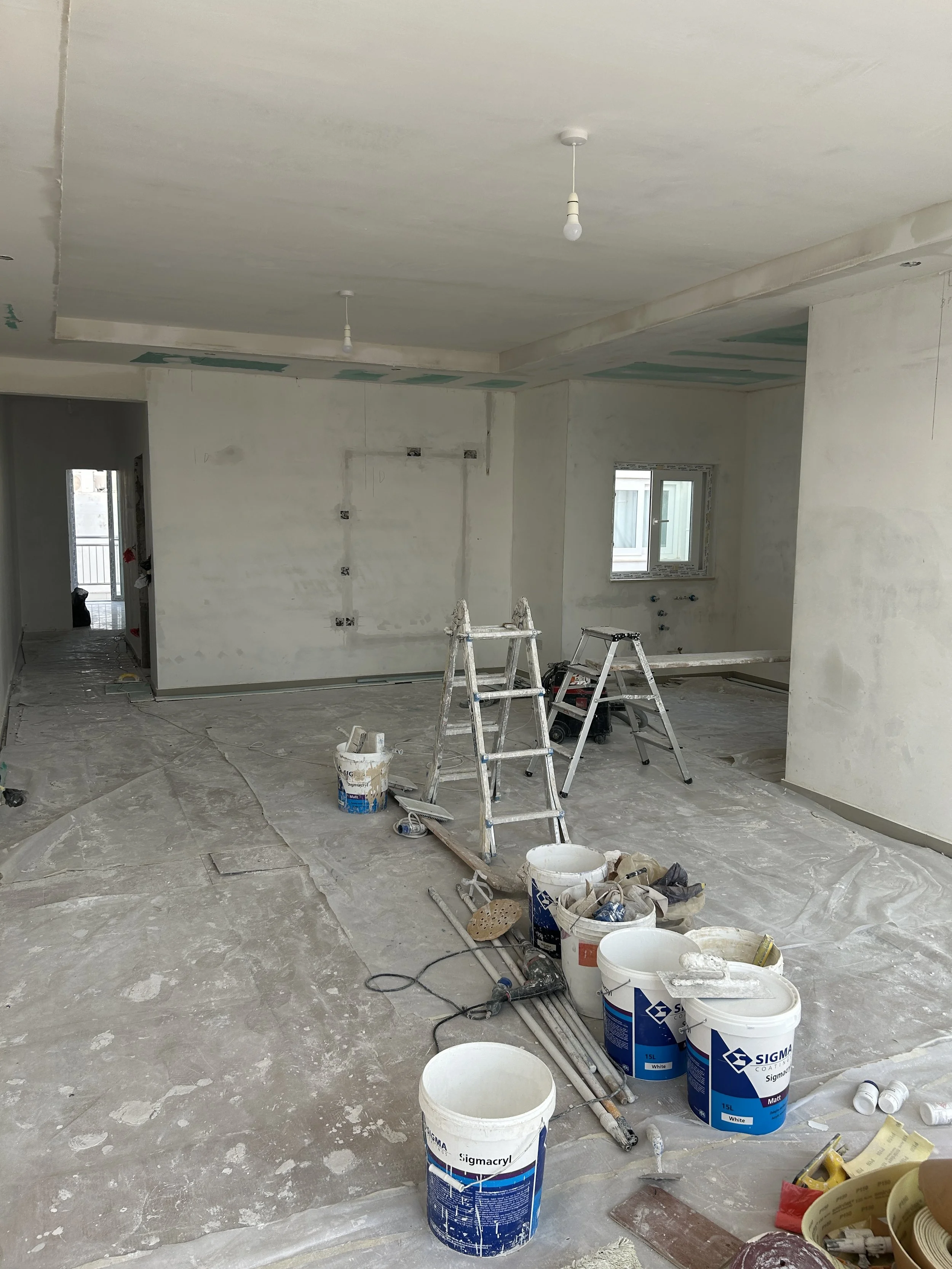 Before photo of an open-plan space prior to painting.