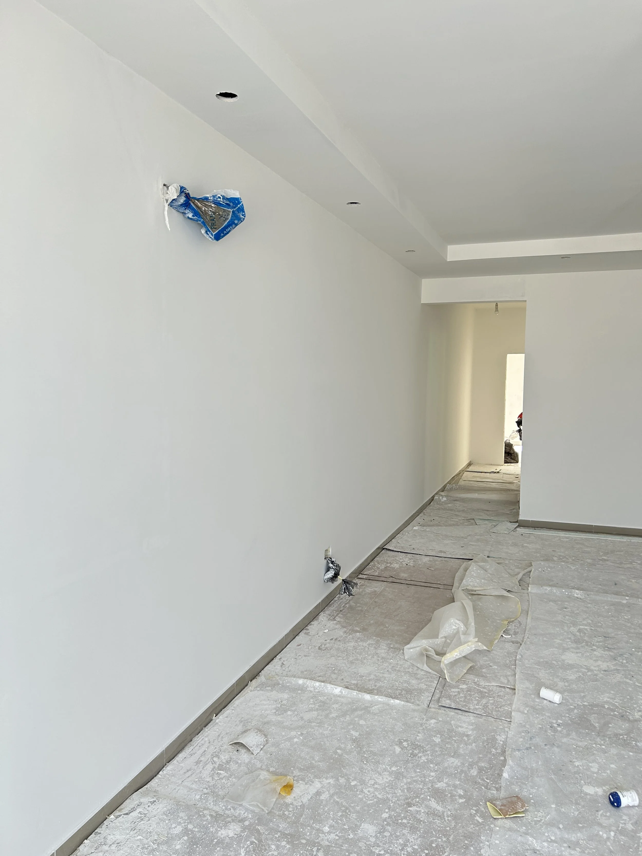 White painted corridor in Malta with a smooth interior wall finish.