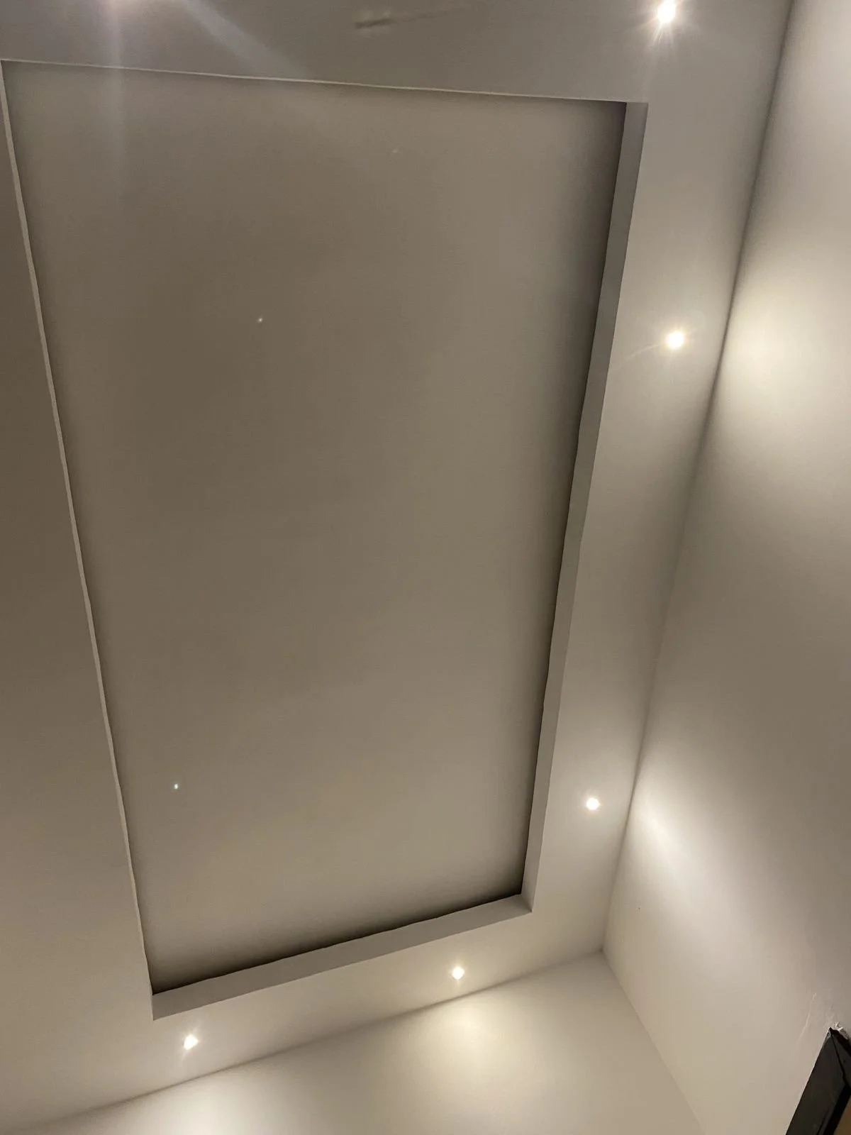 Bedroom gypsum bulkhead with concealed rope lighting creating a warm and relaxing atmosphere in Malta