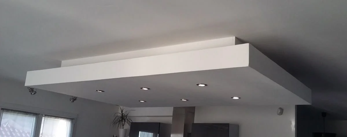 Dropped gypsum ceiling design above a kitchen island with integrated lighting in a Maltese home