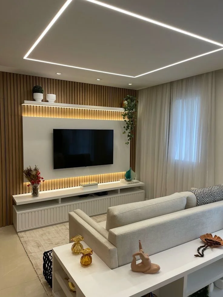 Living room gypsum ceiling featuring LED profile lighting for a modern interior