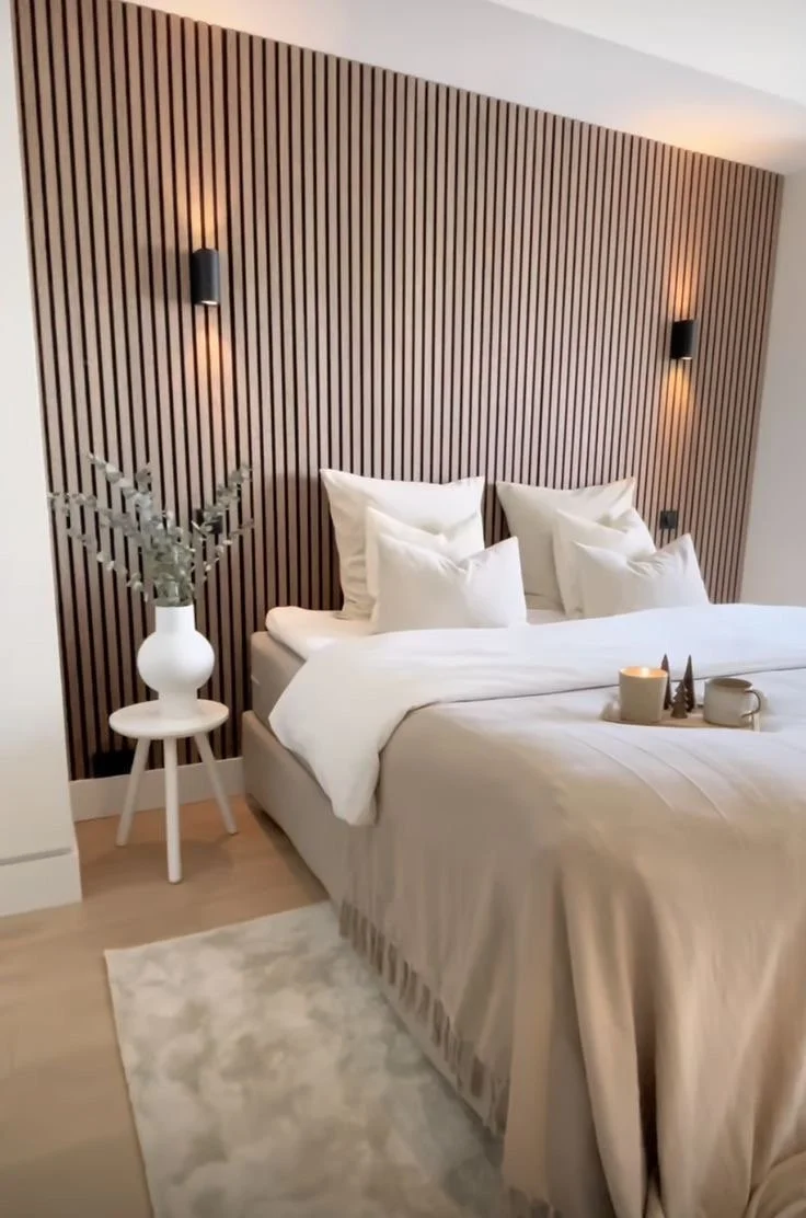 Wooden slat wall feature in a bedroom adding texture and warmth to a Maltese home