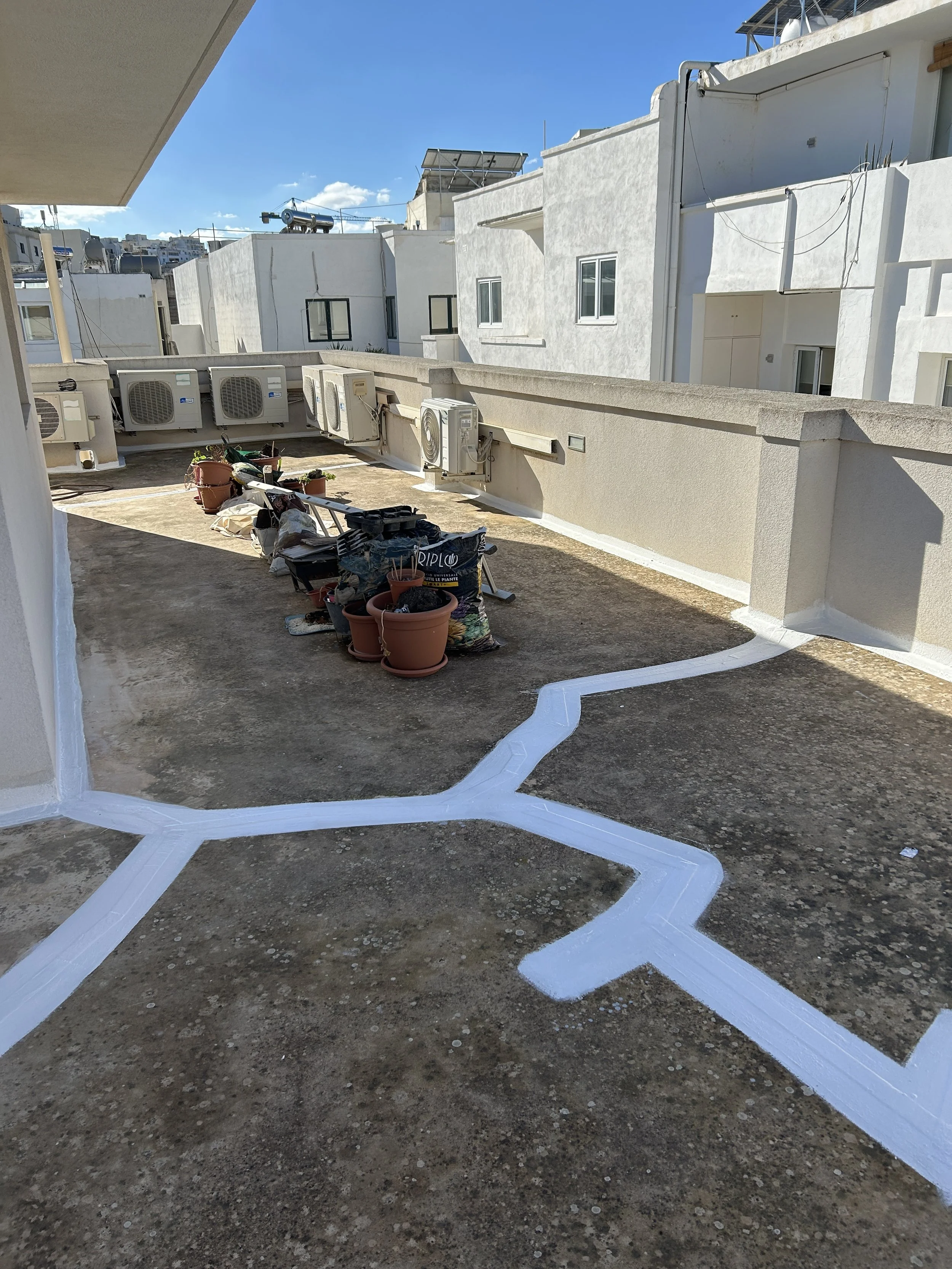 Application of flashband and liquid membrane on roof joints.