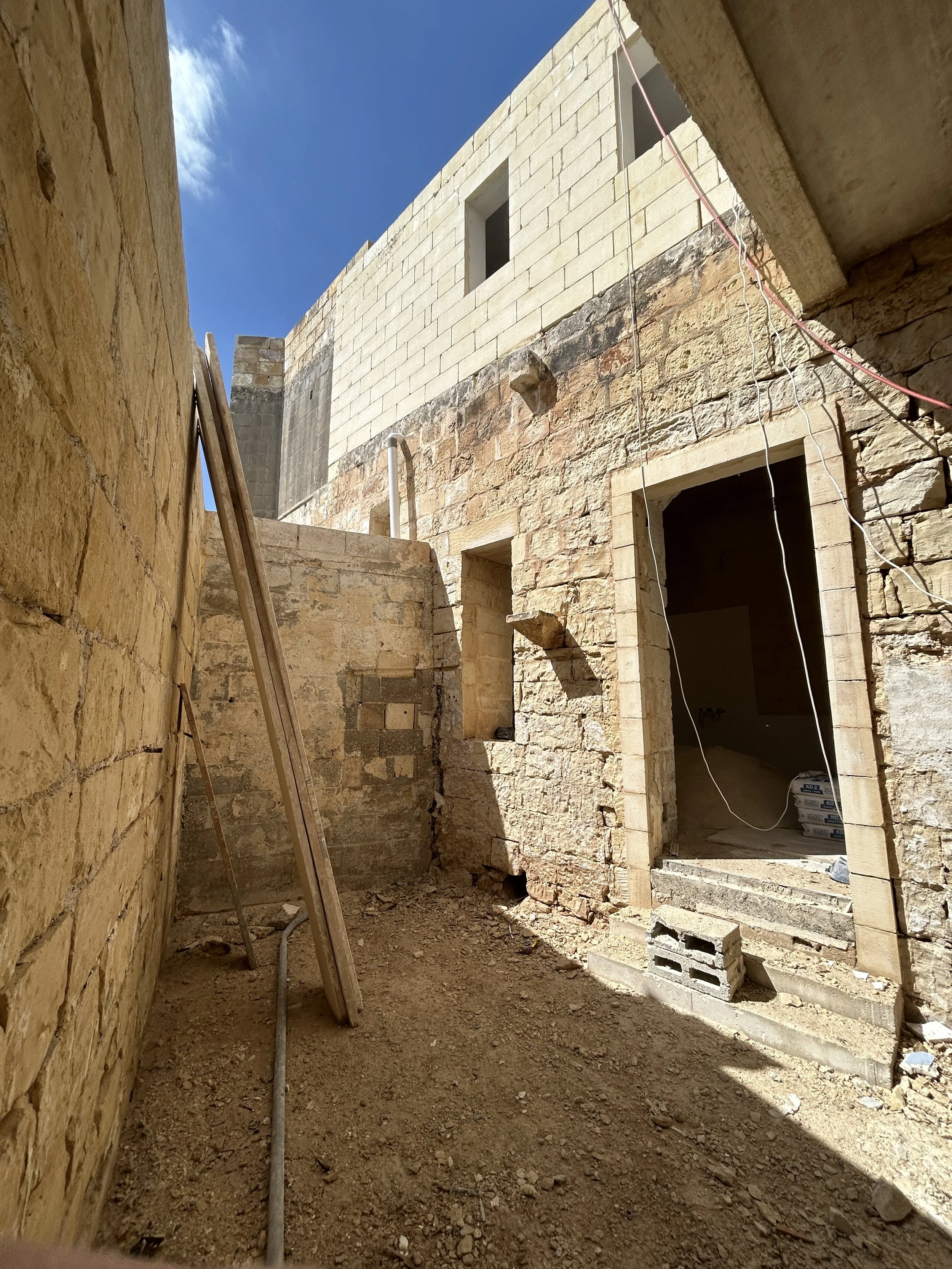 Before photo of internal yard prior to plastering works.