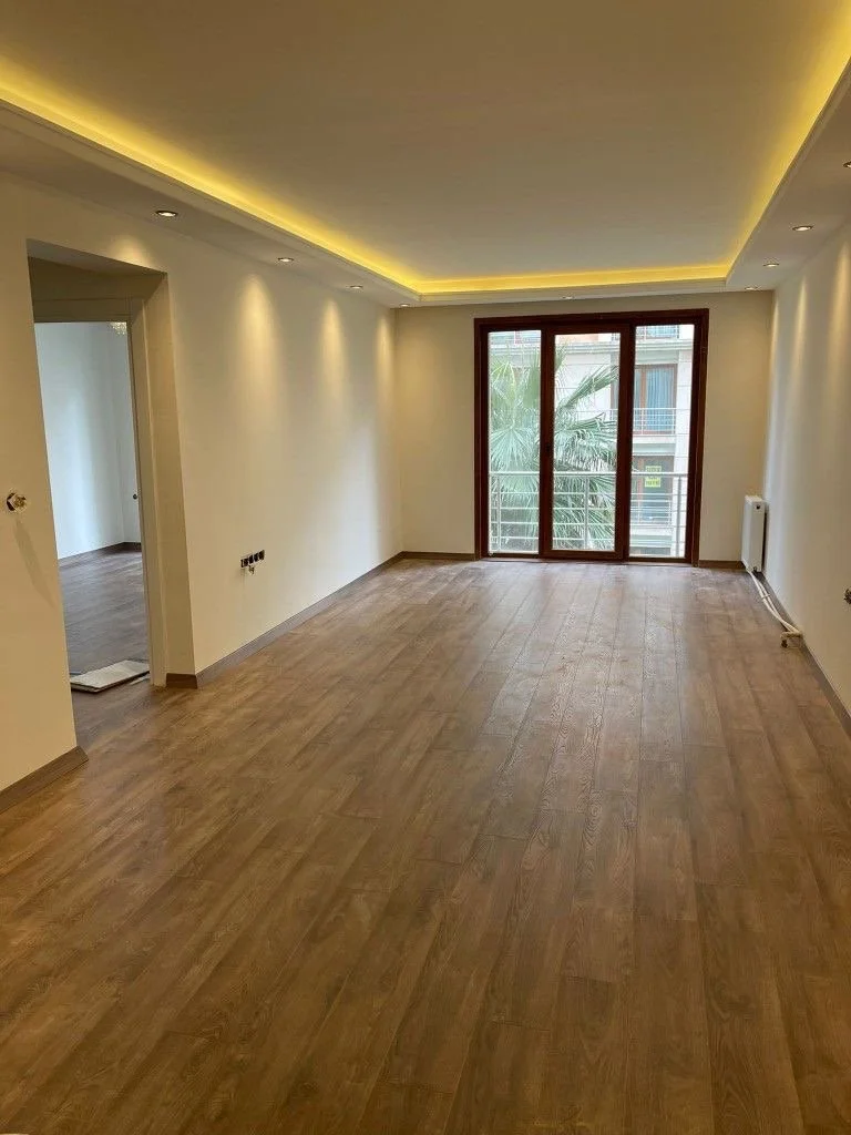 Gypsum bulkhead with hidden rope lighting in an open plan space for soft ambient lighting in a Maltese home