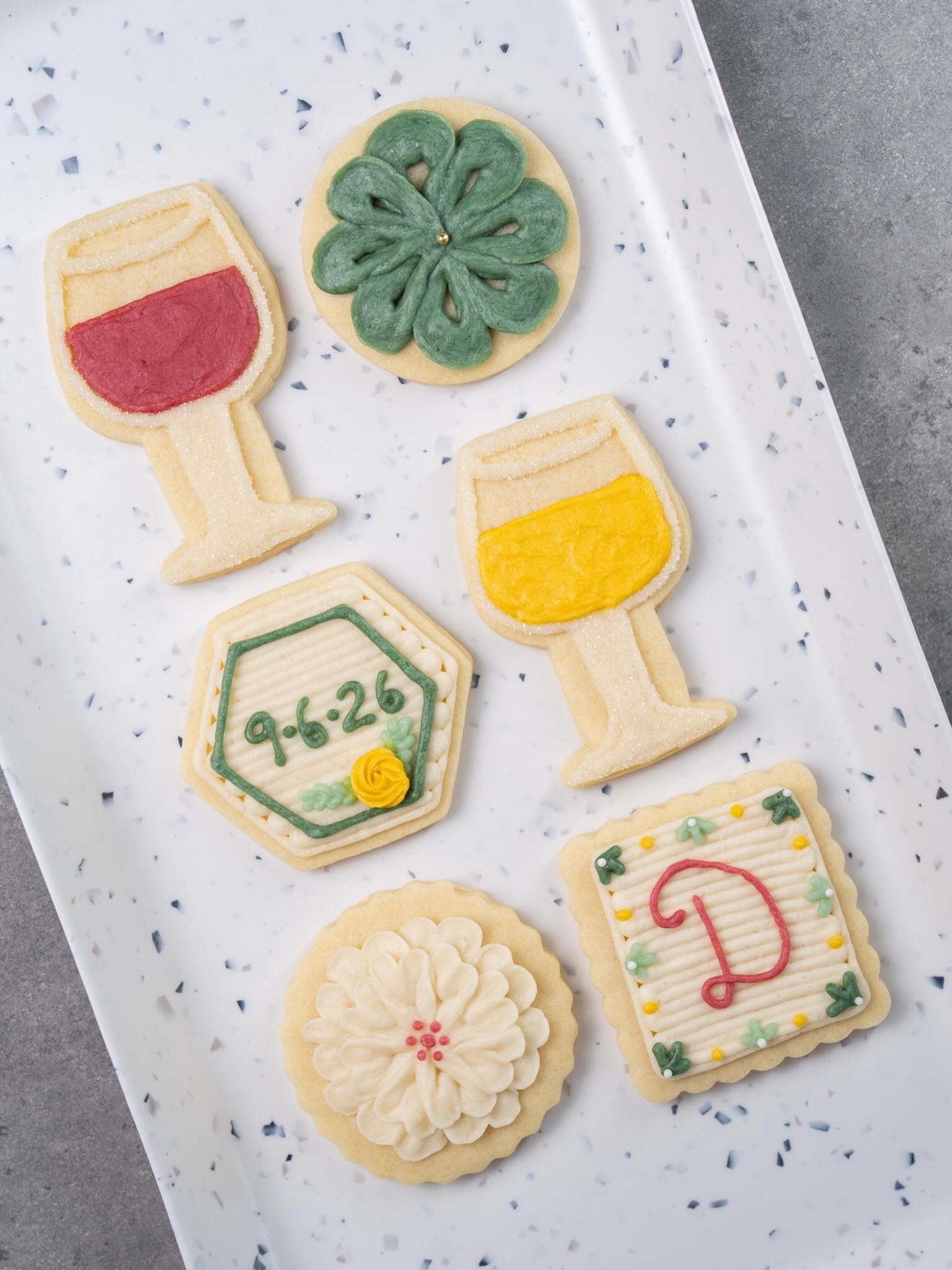 One of my favorite things to create is desserts that feel completely personal to the celebration 🤍

These custom buttercream sugar cookies were made for a bridal shower wine tasting - soft florals, wine glasses, and elegant little details in dark gr