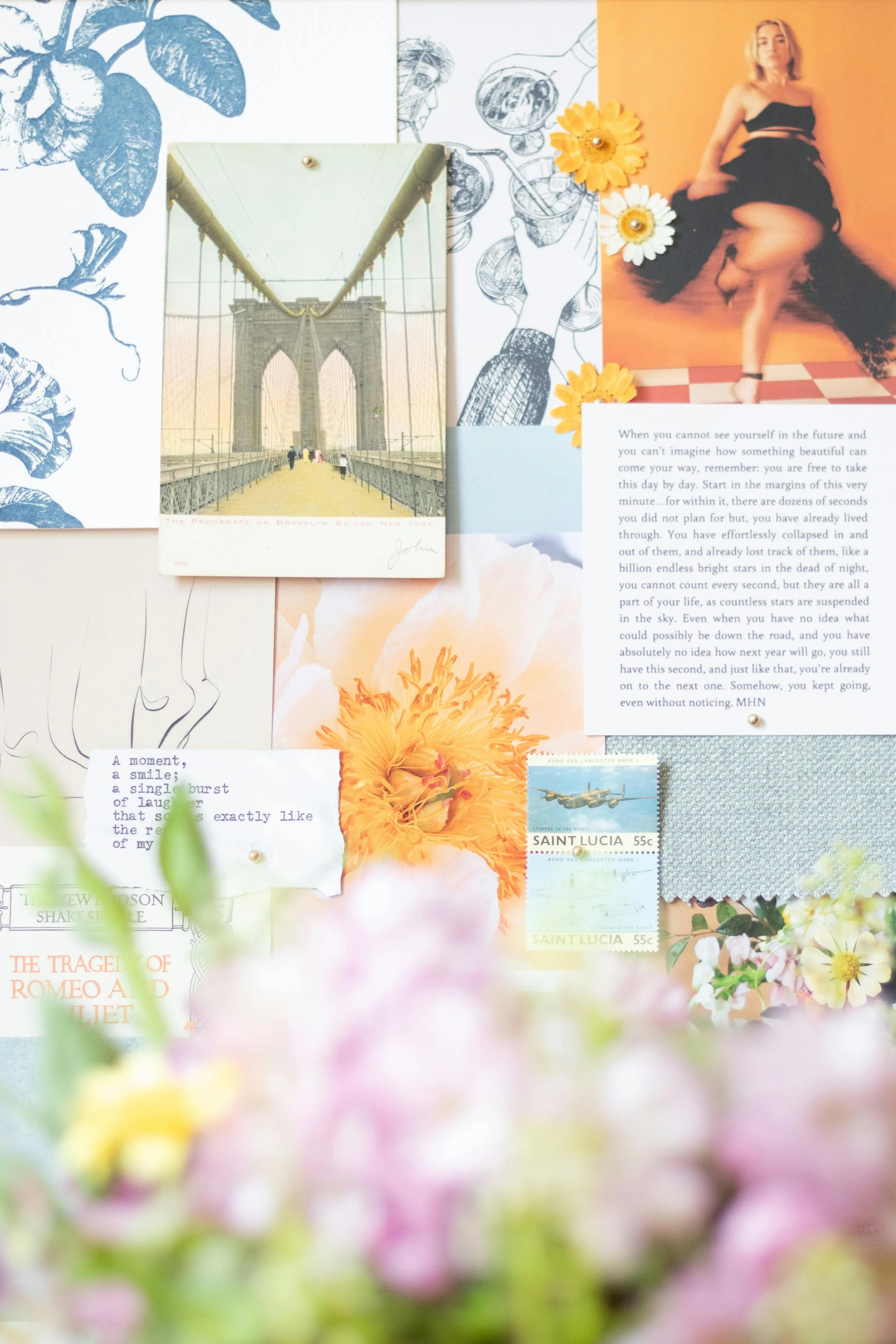 A collage of various paper items, including postcards, photographs, drawings, flowers, and notes, arranged on a surface.