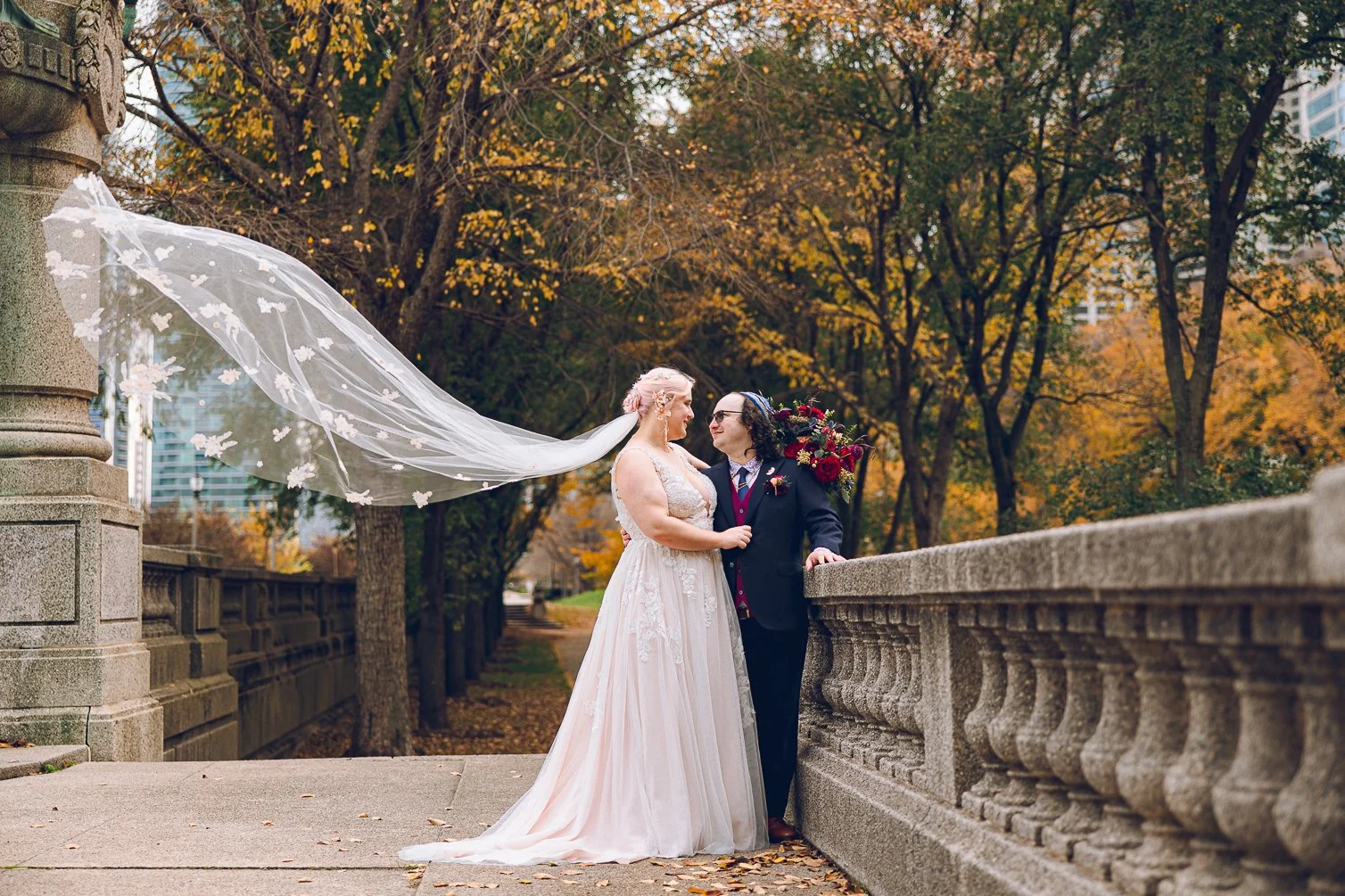 bride and groom on a bridge